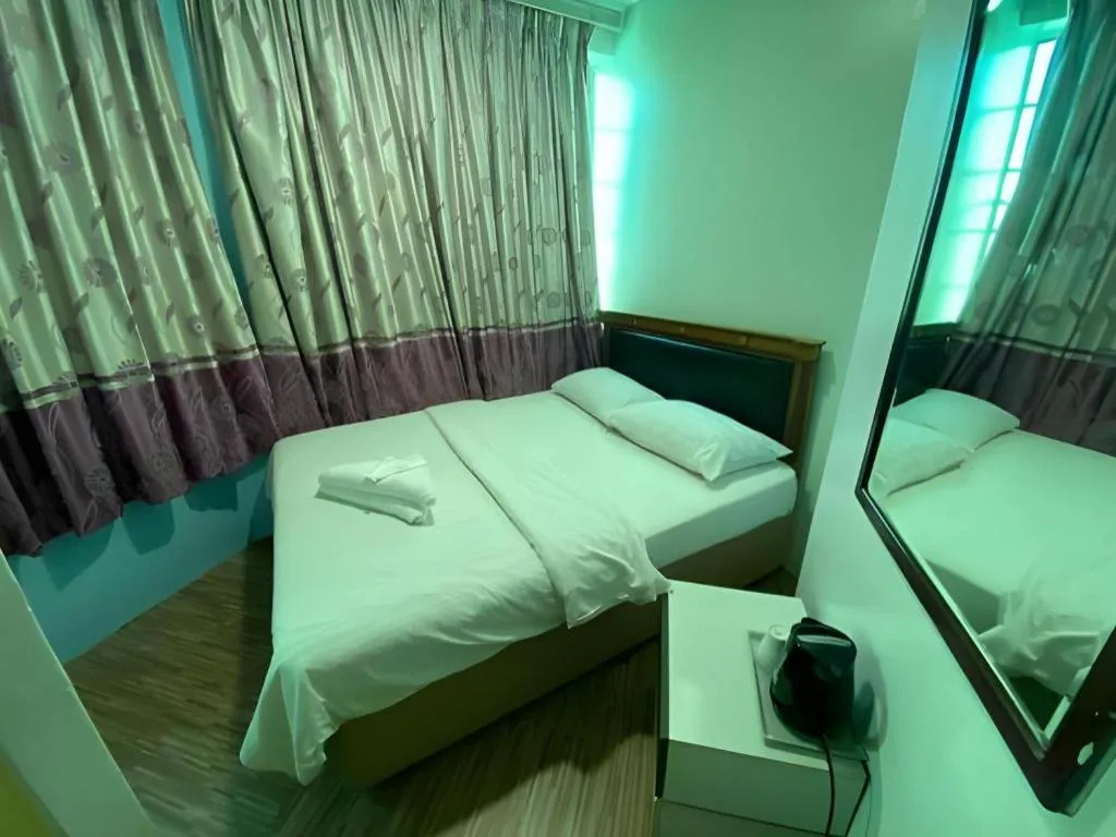 Bed in Meriton Hotel