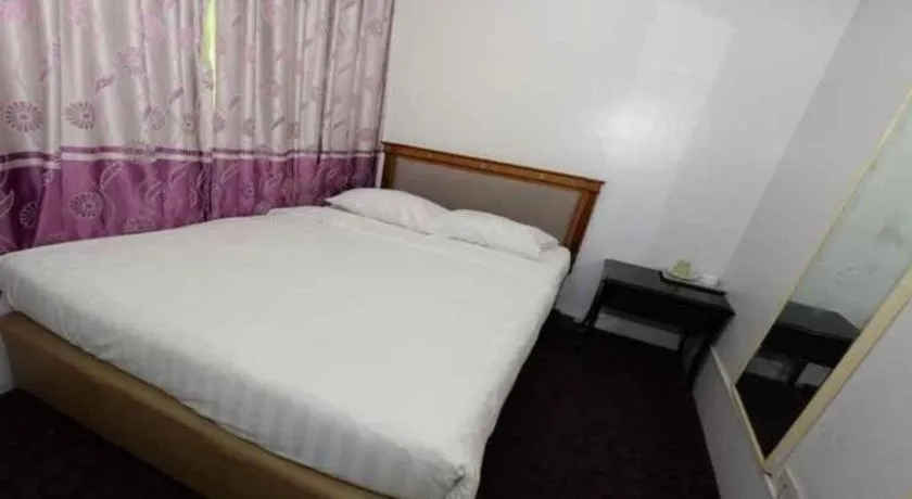 Bed in Meriton Hotel