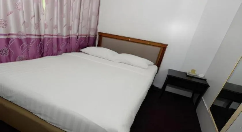 Bed in Meriton Hotel