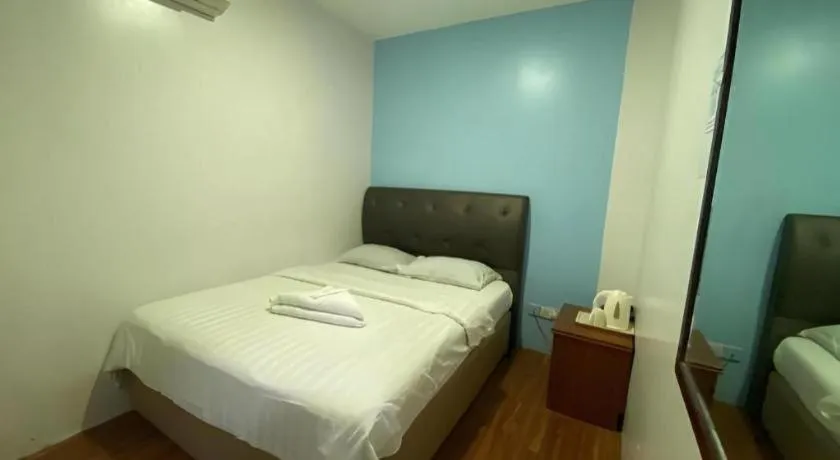 Bed in Meriton Hotel