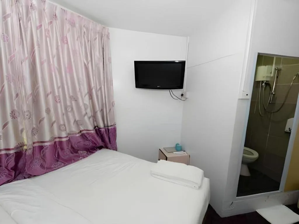 Bed in Meriton Hotel