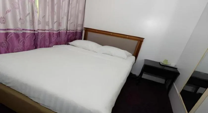 Bed in Meriton Hotel