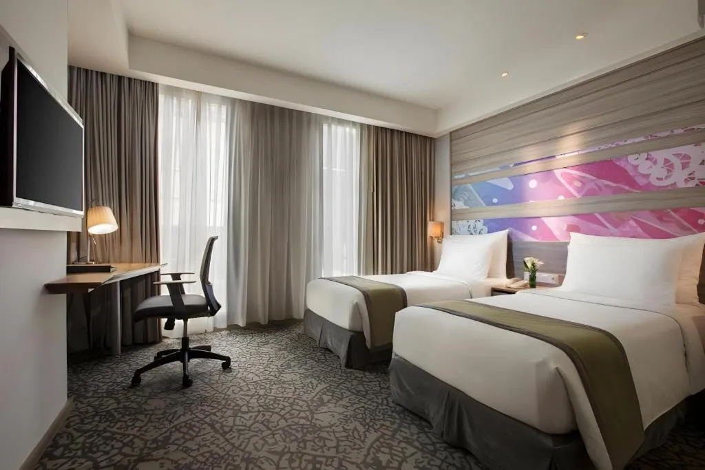 Bed in Hotel GranDhika Iskandarsyah