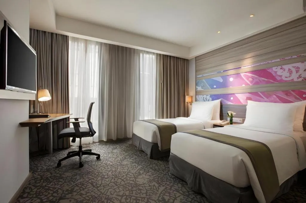 Bed in Hotel GranDhika Iskandarsyah