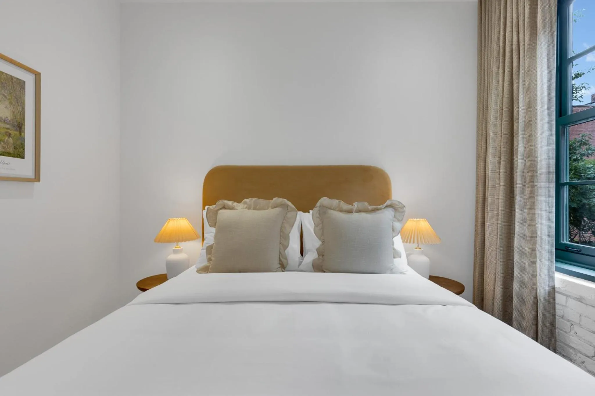 Bed in The Mercer Boutique Hotel