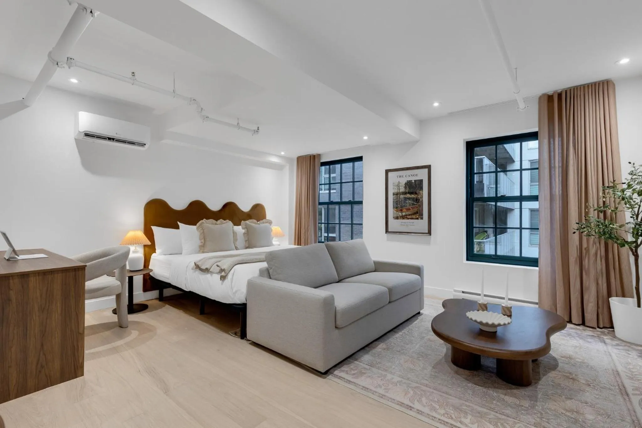 Bed in The Mercer Boutique Hotel