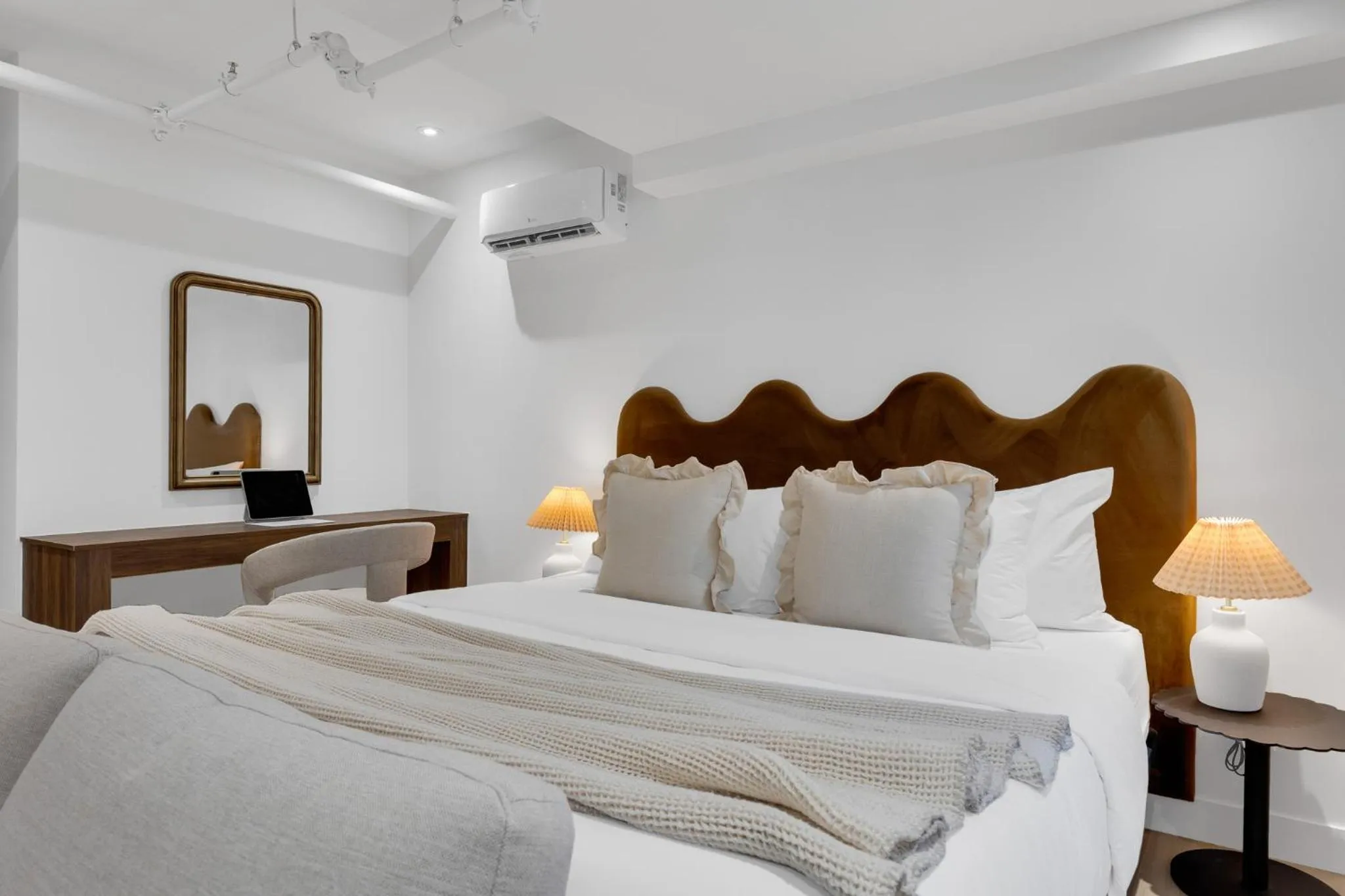 Bed in The Mercer Boutique Hotel