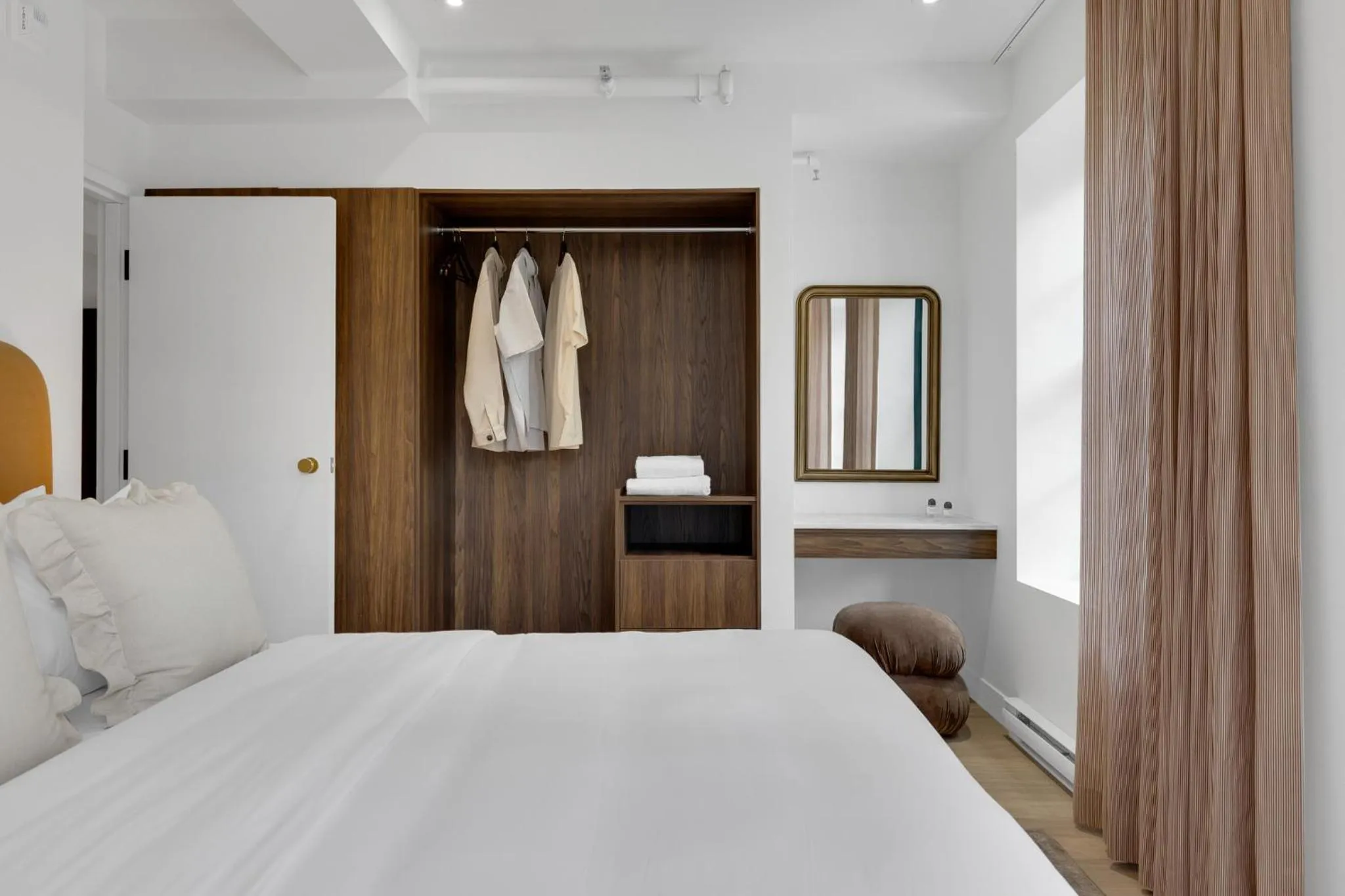 Bed in The Mercer Boutique Hotel