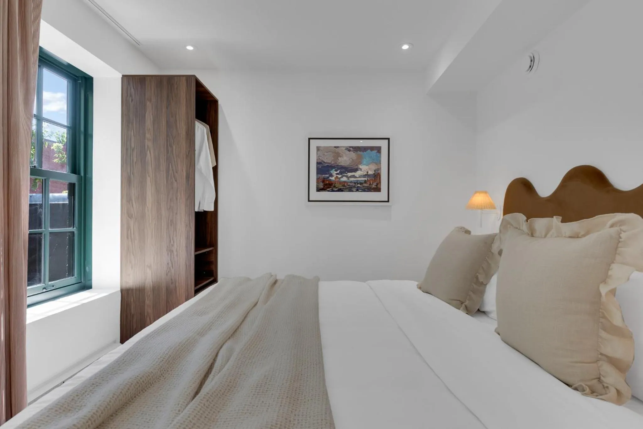 Bed in The Mercer Boutique Hotel