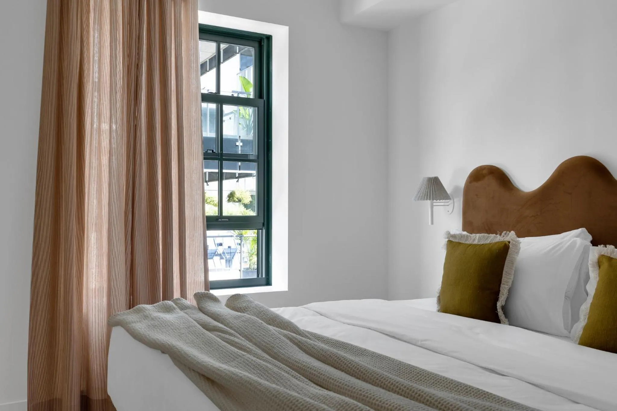 Bed in The Mercer Boutique Hotel