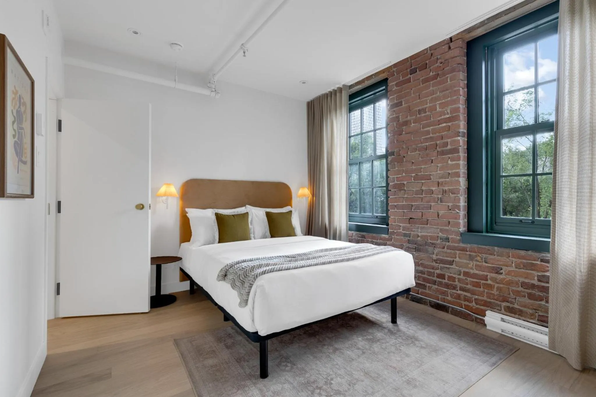 Bed in The Mercer Boutique Hotel