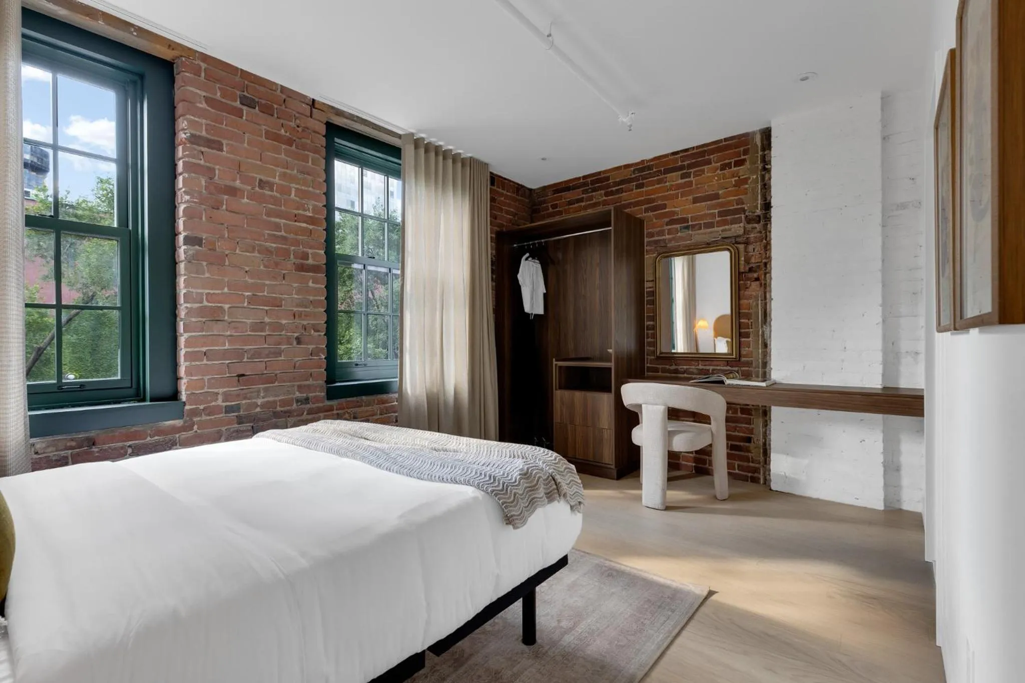 Bed in The Mercer Boutique Hotel