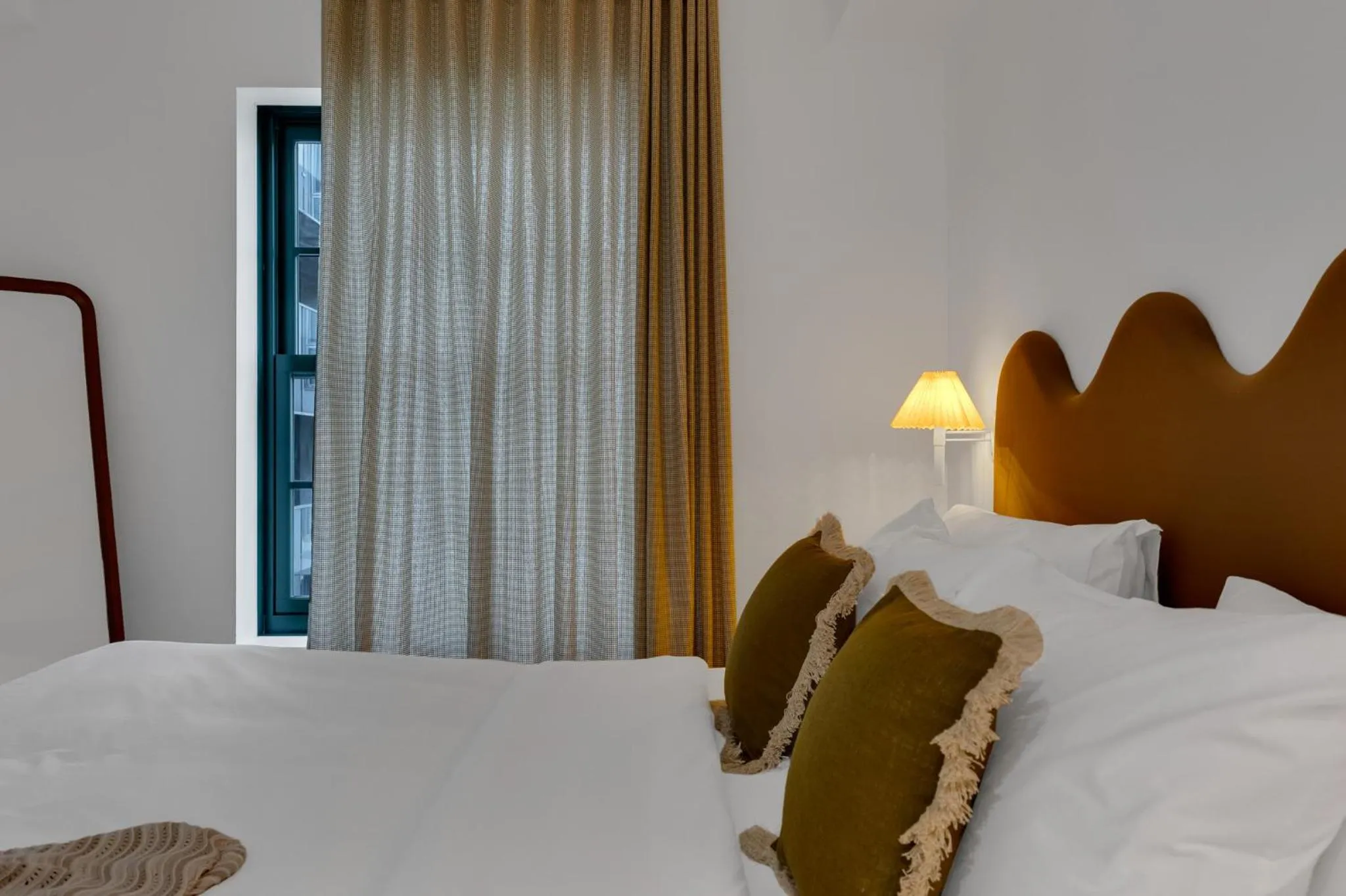 Bed in The Mercer Boutique Hotel