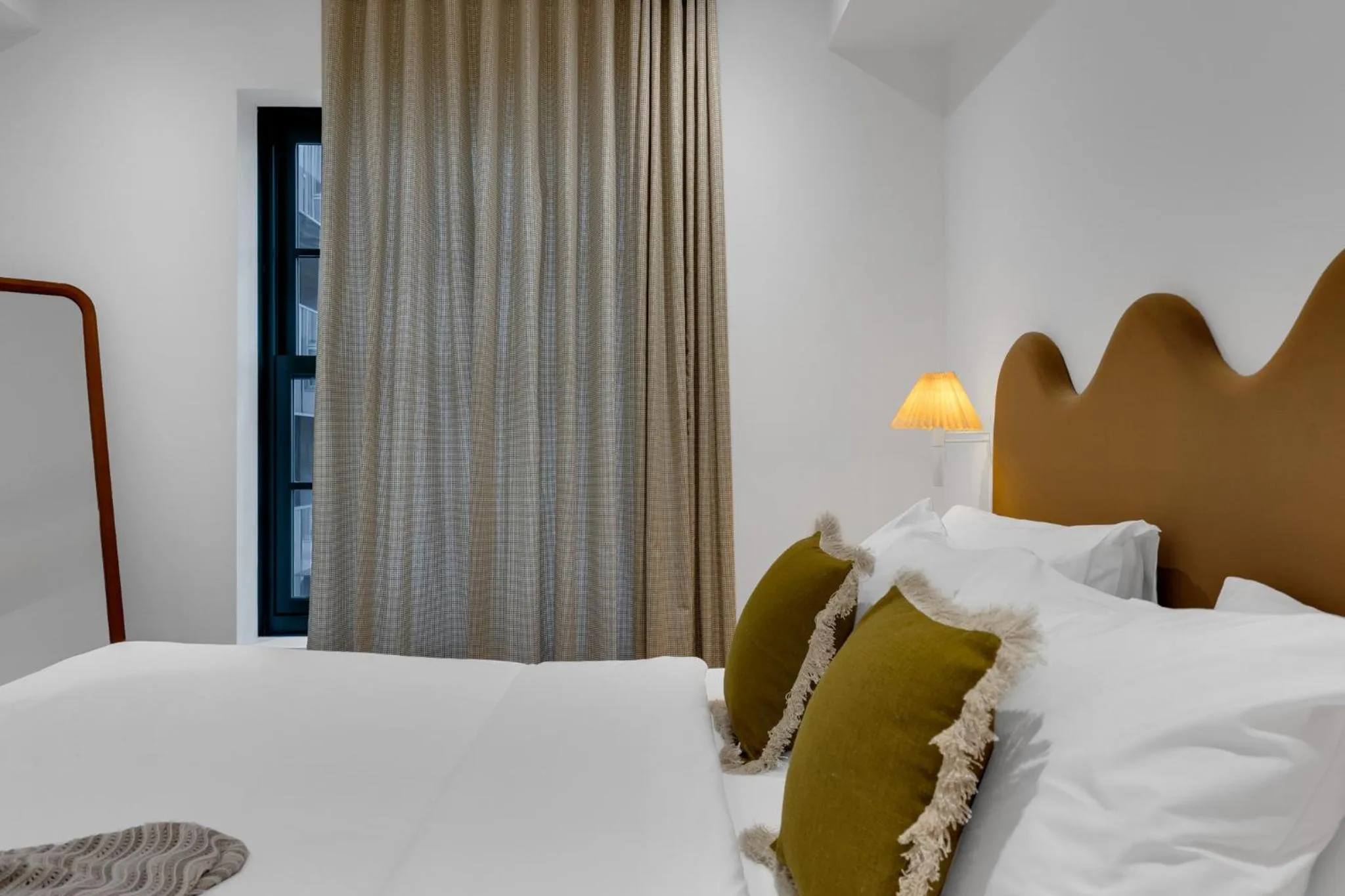 Bed in The Mercer Boutique Hotel