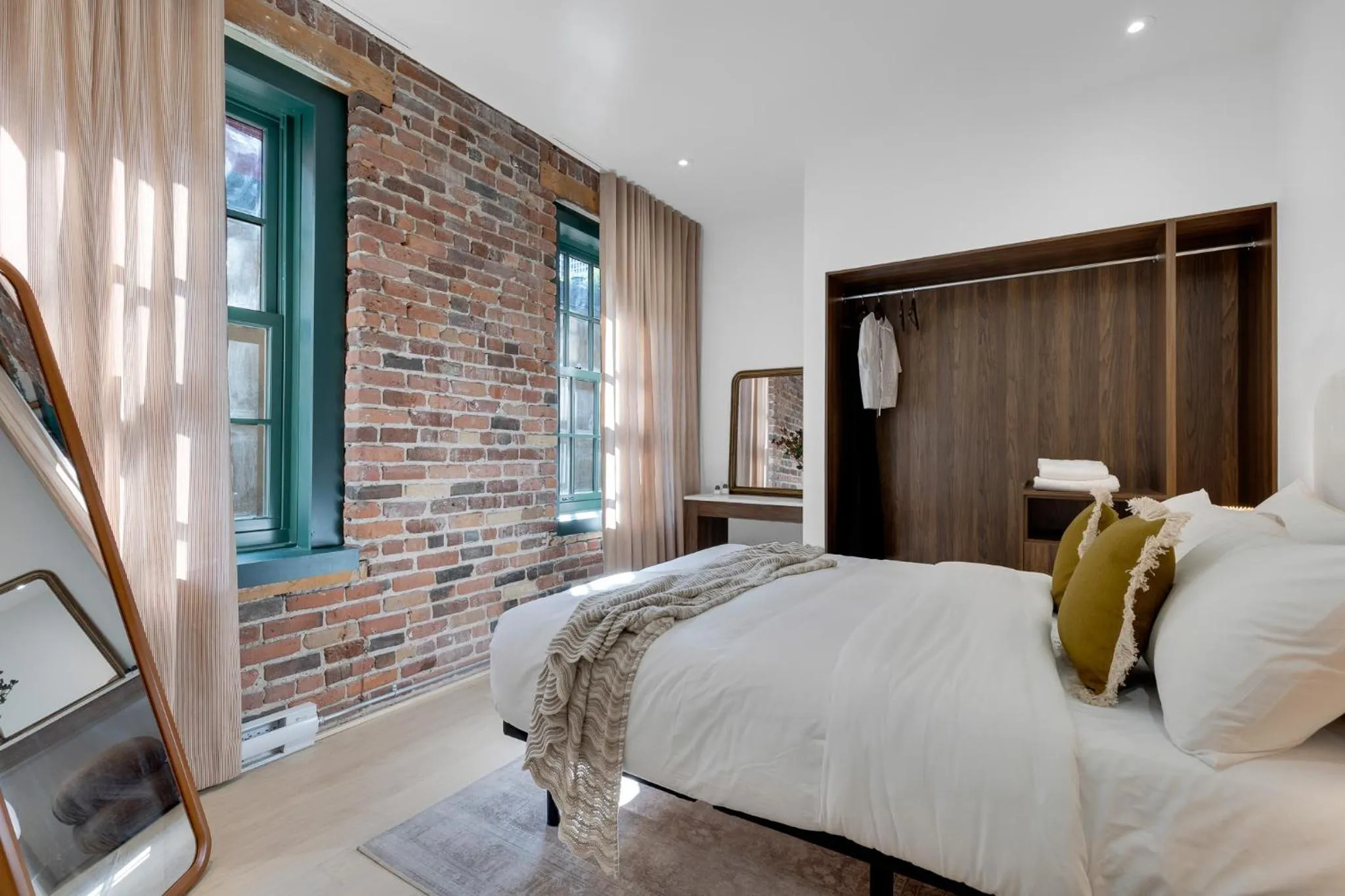 Bed in The Mercer Boutique Hotel