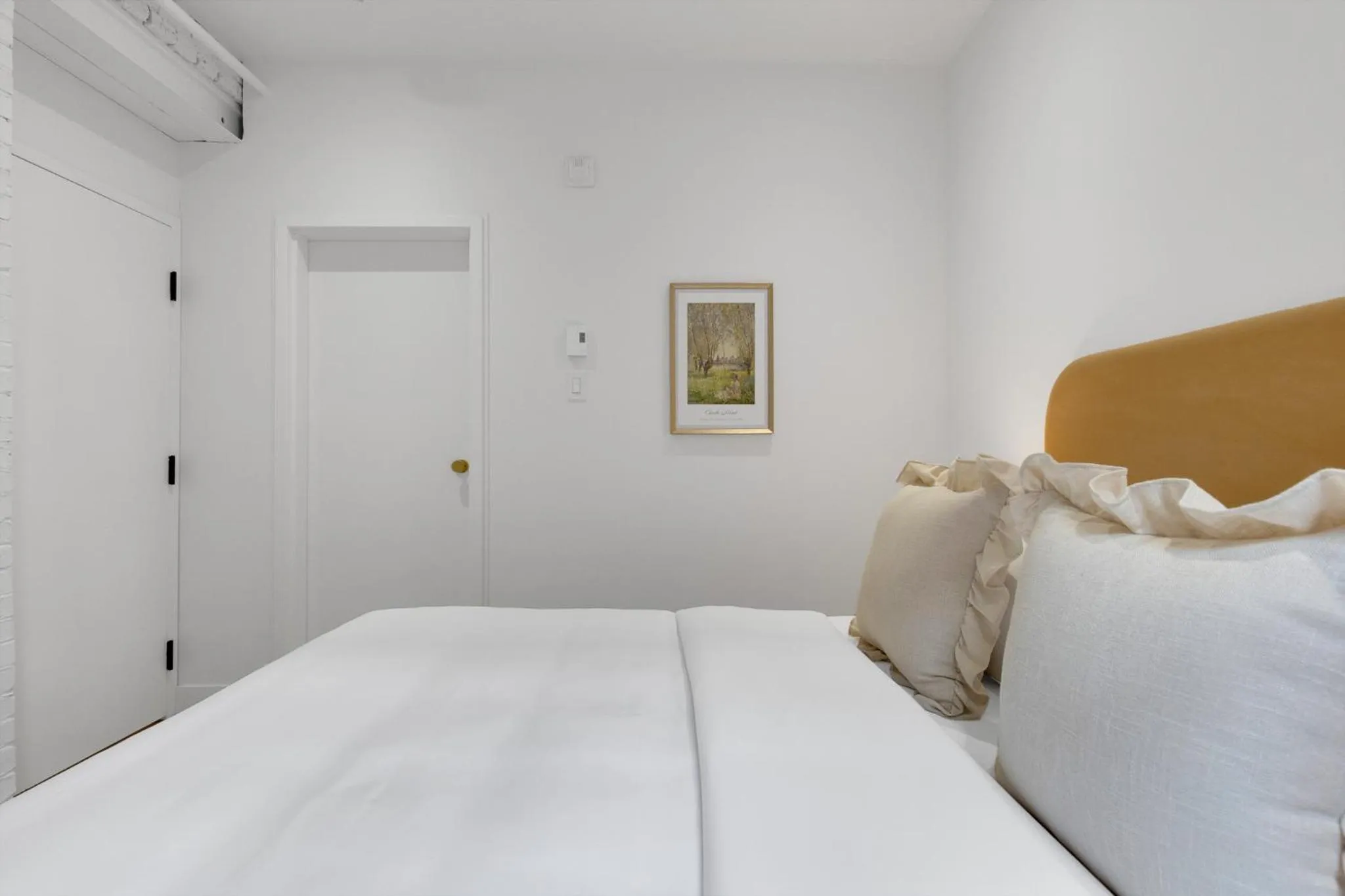 Bed in The Mercer Boutique Hotel