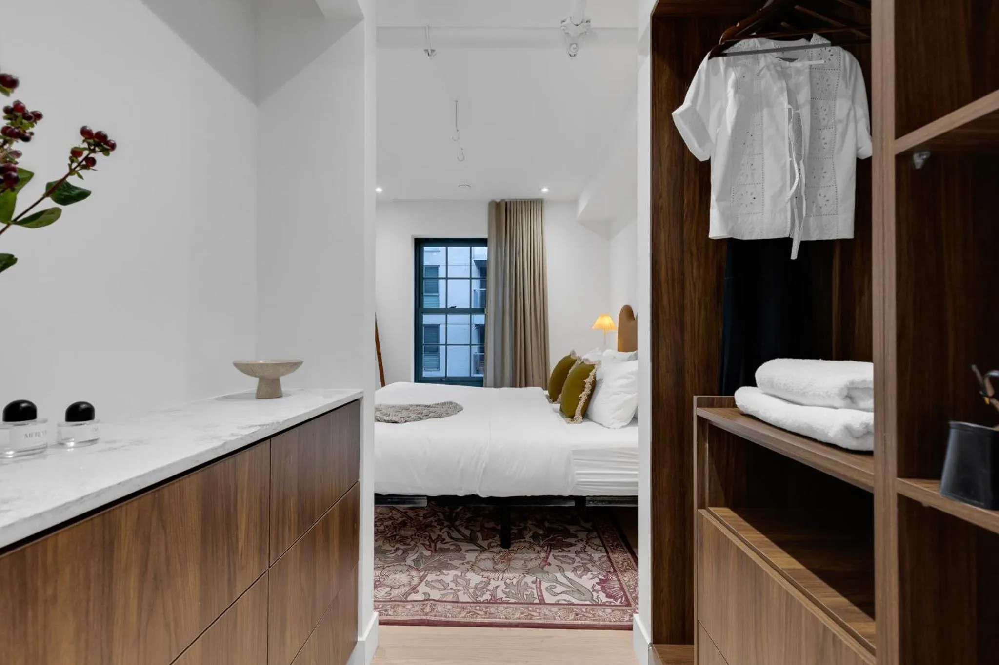 Bed in The Mercer Boutique Hotel