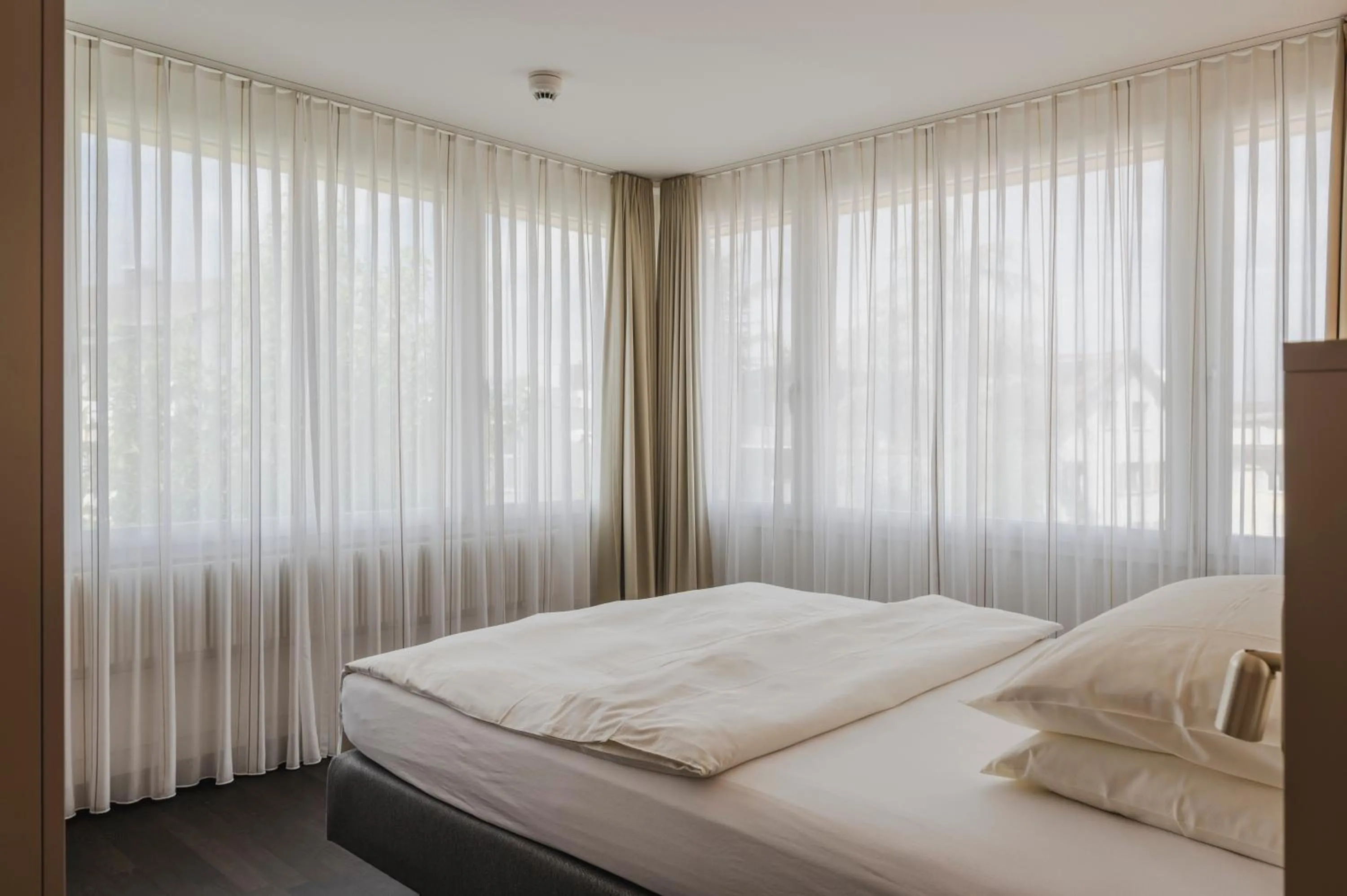 Bed in Amanthos Living Zürich Airport