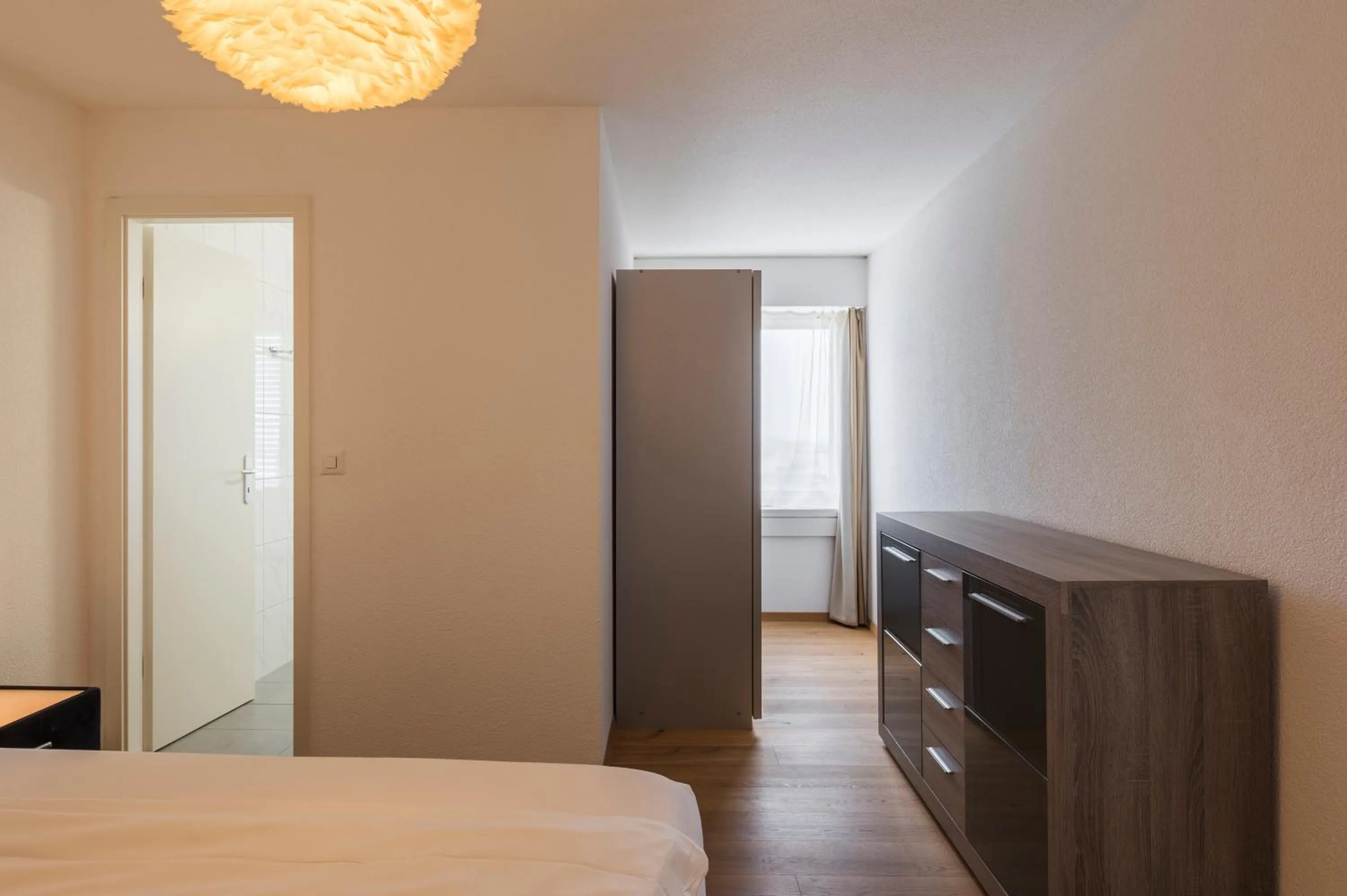 Photo of the whole room, Bed in Amanthos Living Solothurn