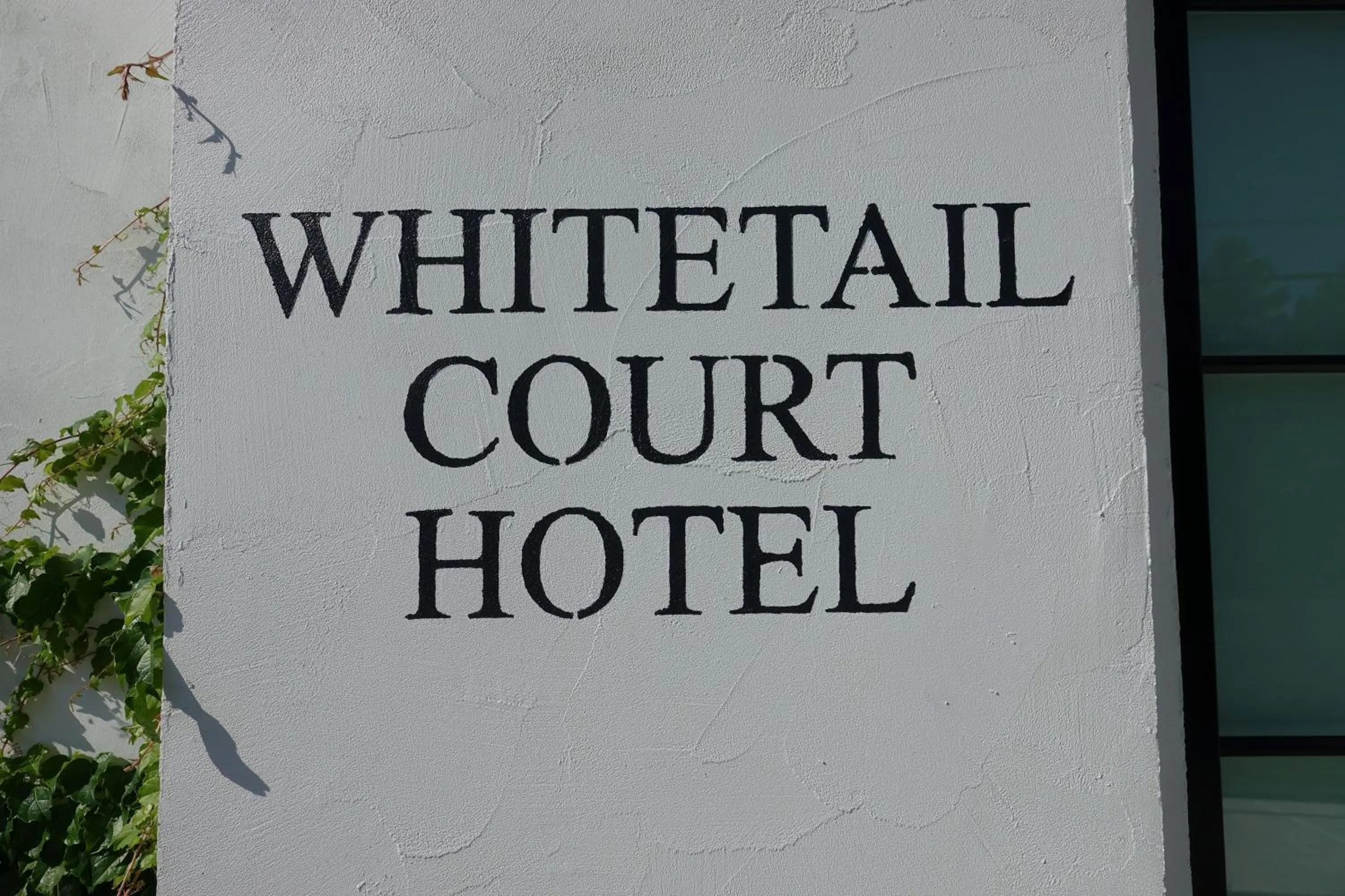 Property logo or sign in Whitetail Court Hotel