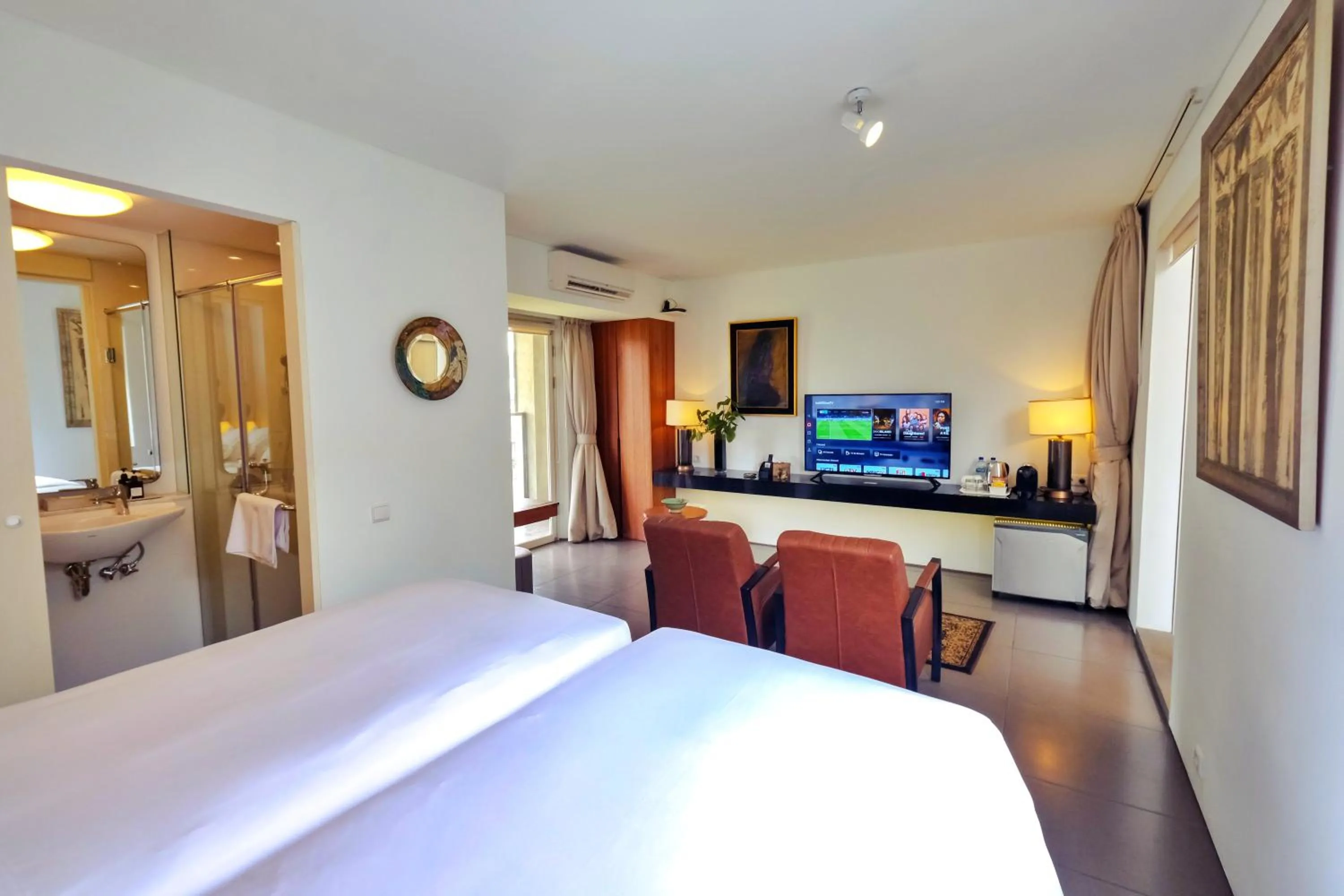 Bed in KoenoKoeni Boutique Hotel