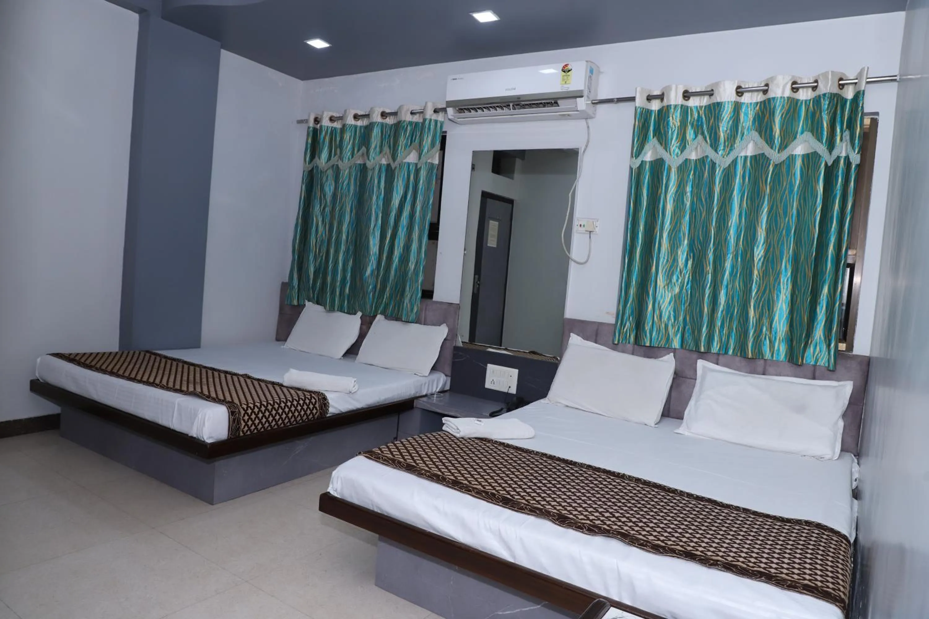 Bed in Hotel Mittal Inn