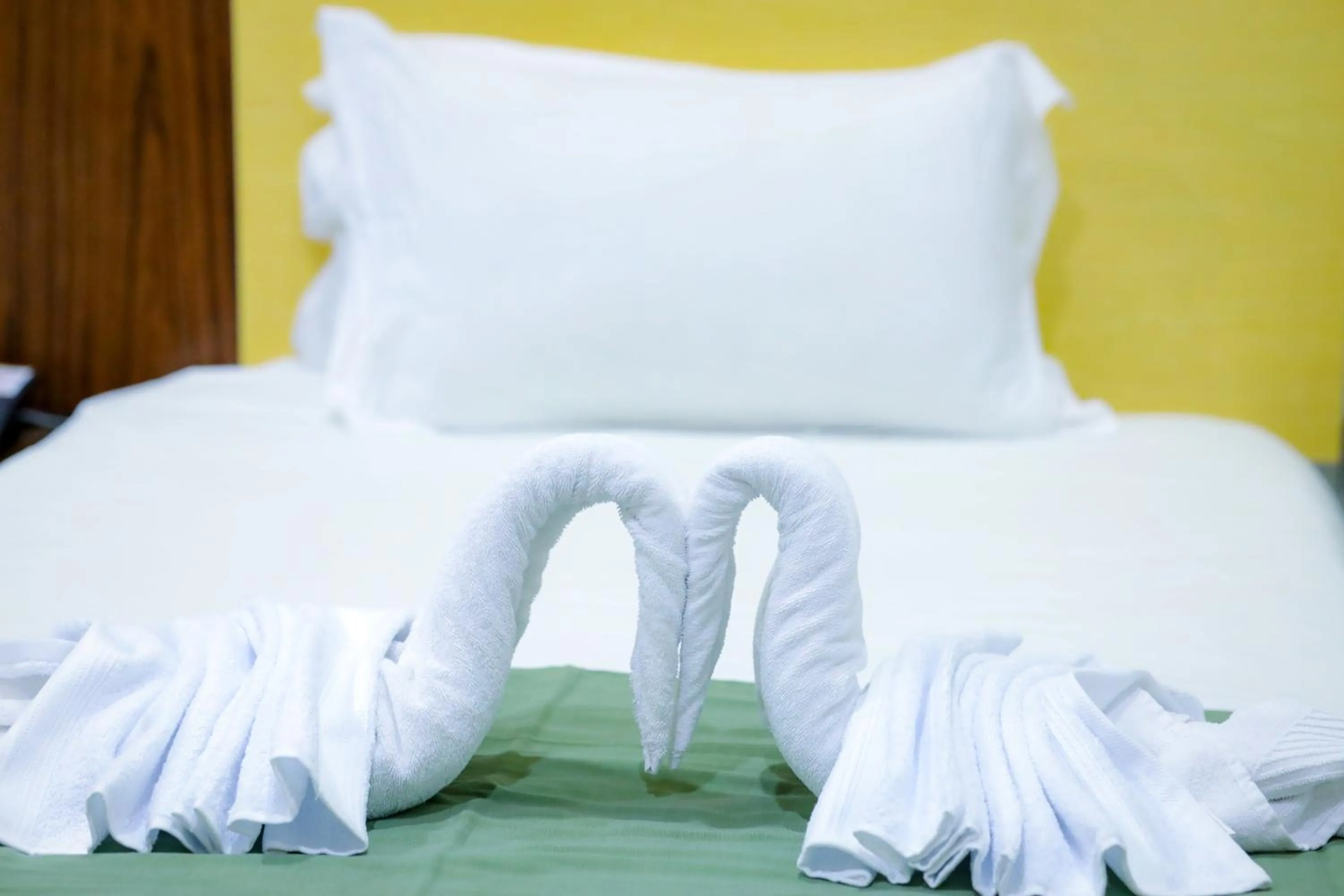 Bed in Doha Dynasty Hotel