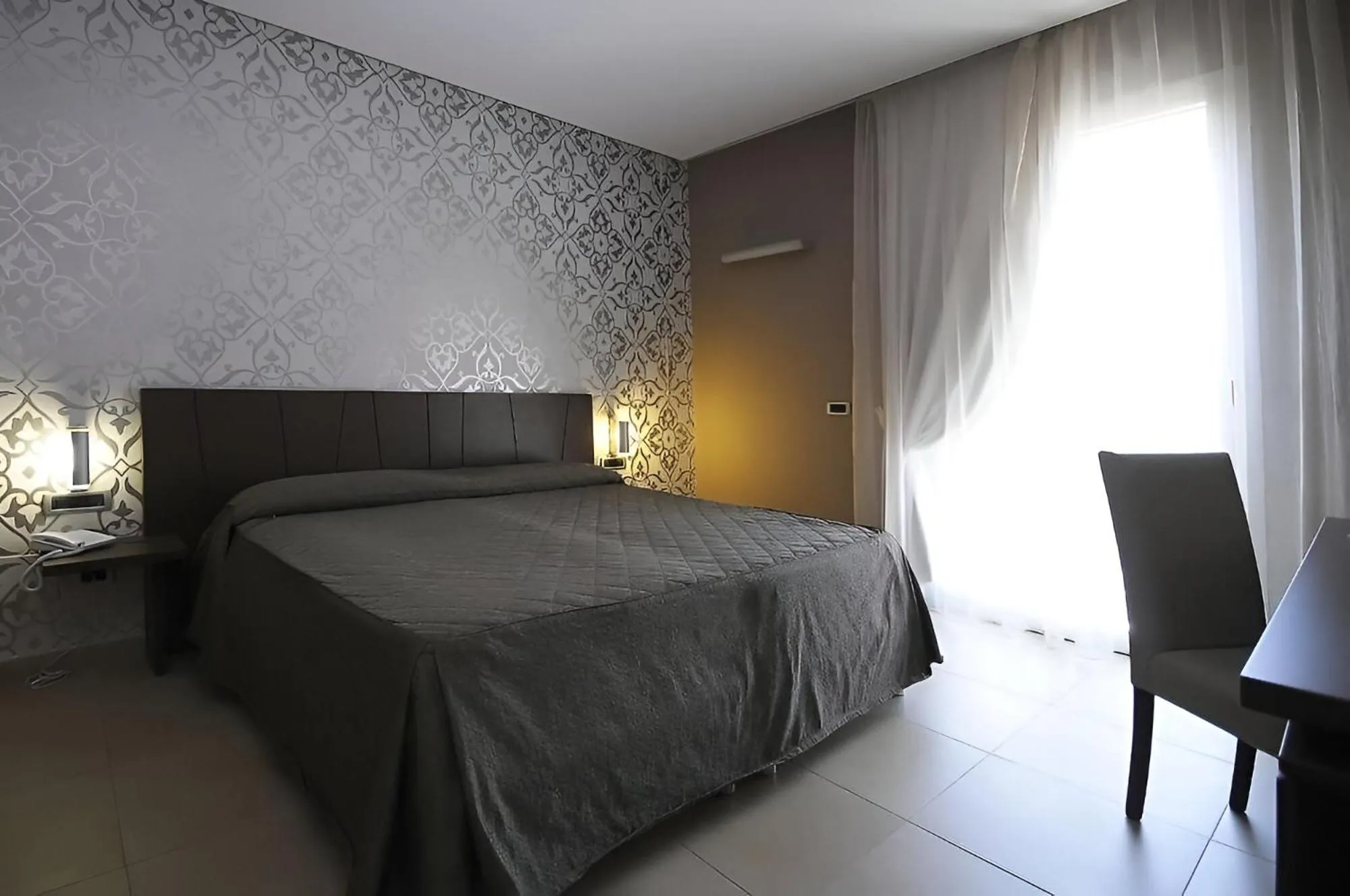 Bed in Sunrise Hotel