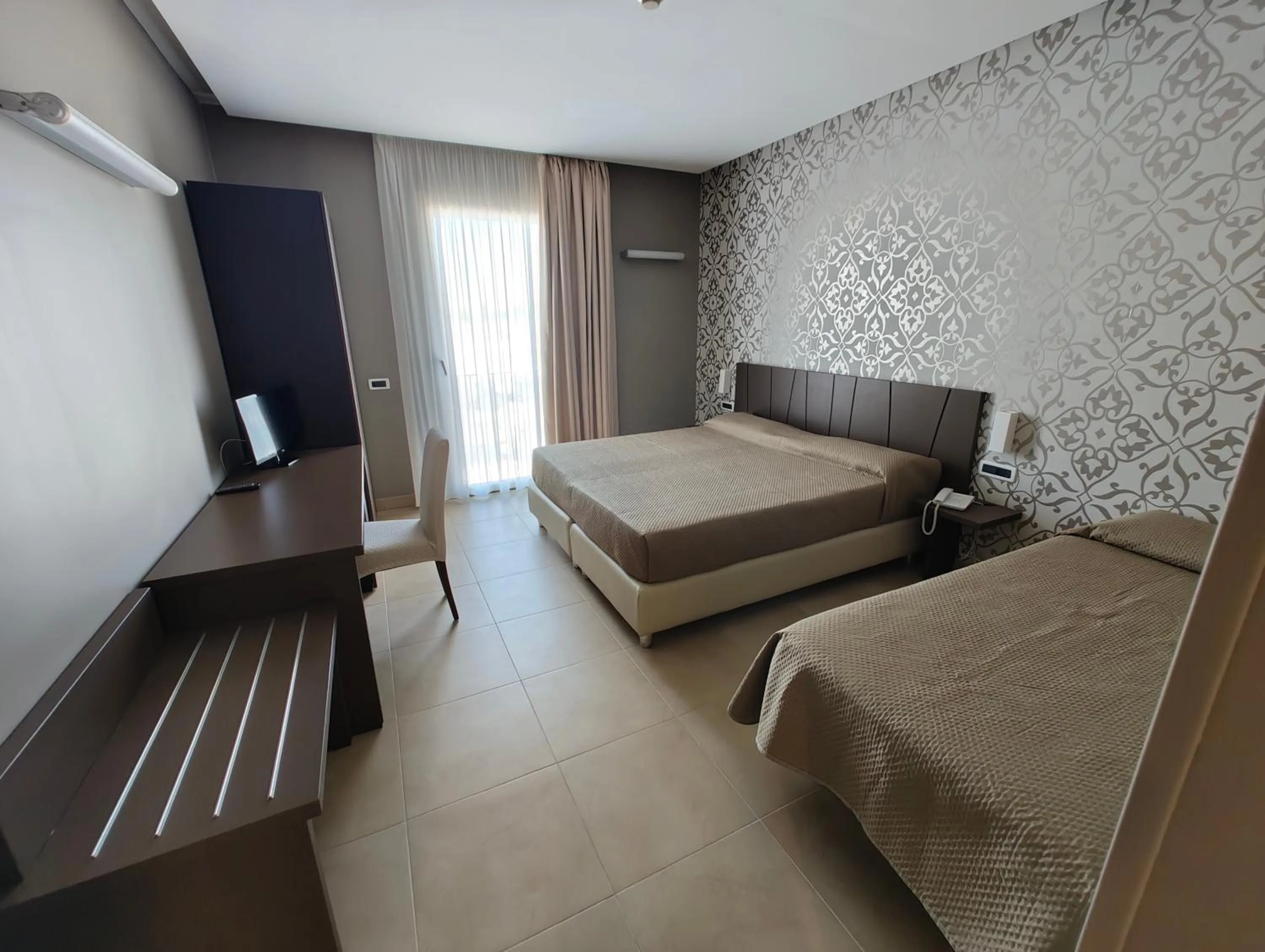 Bed in Sunrise Hotel