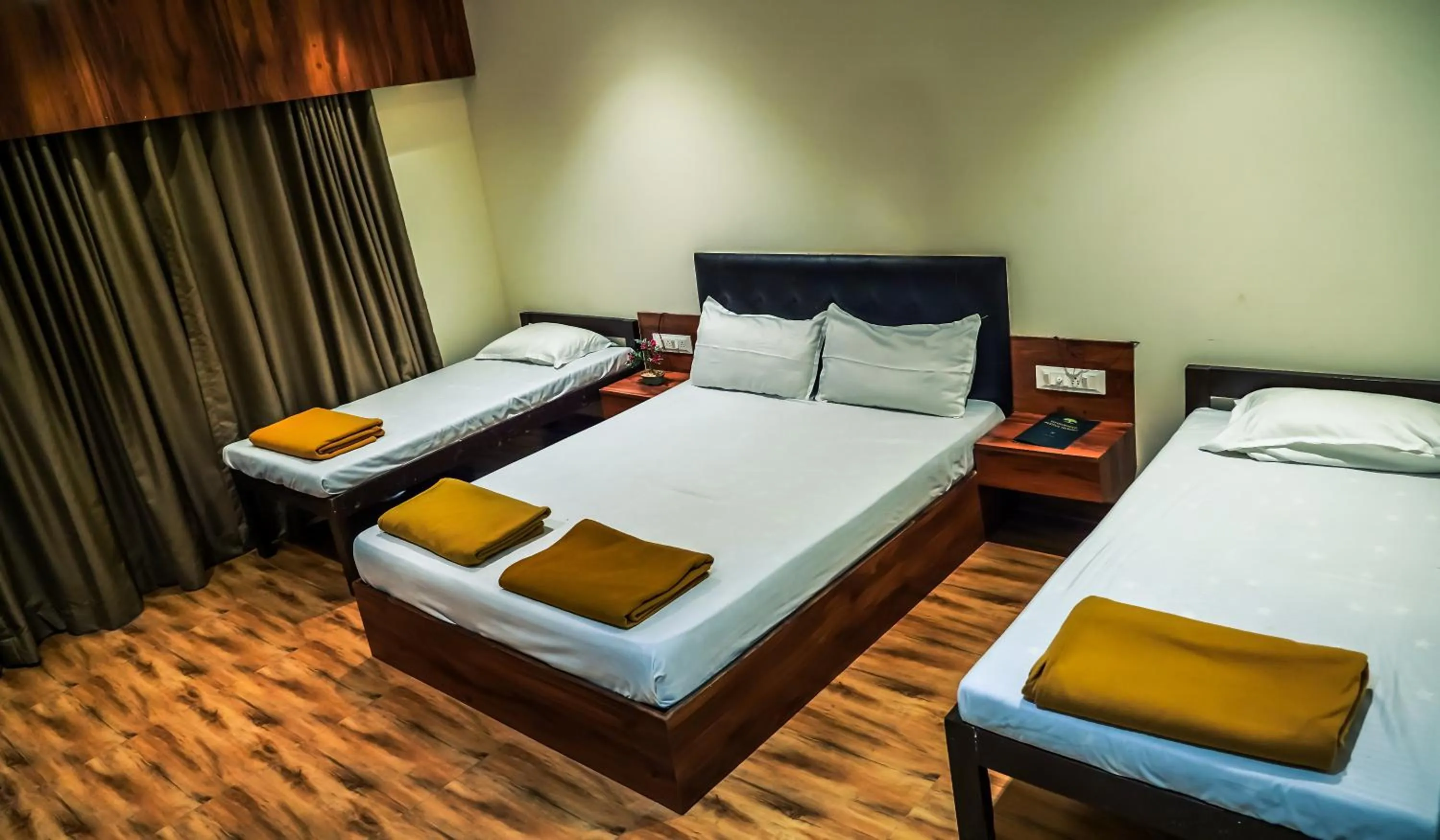 Bed in Whispering Peepul Resort