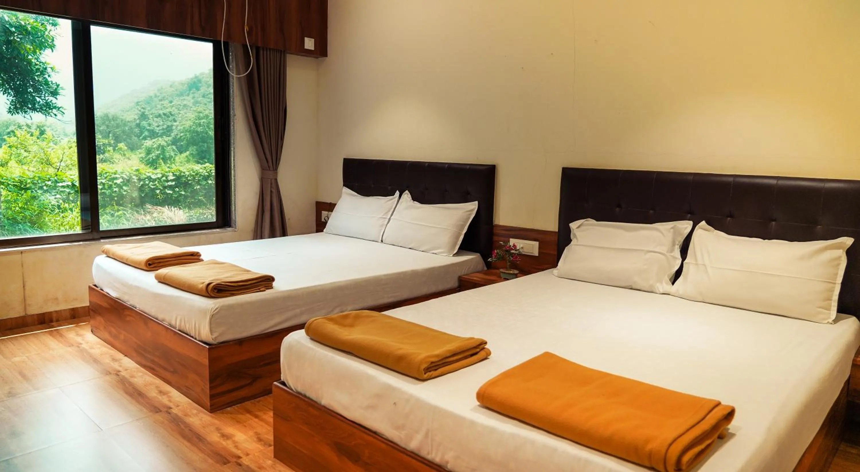 Bed in Whispering Peepul Resort