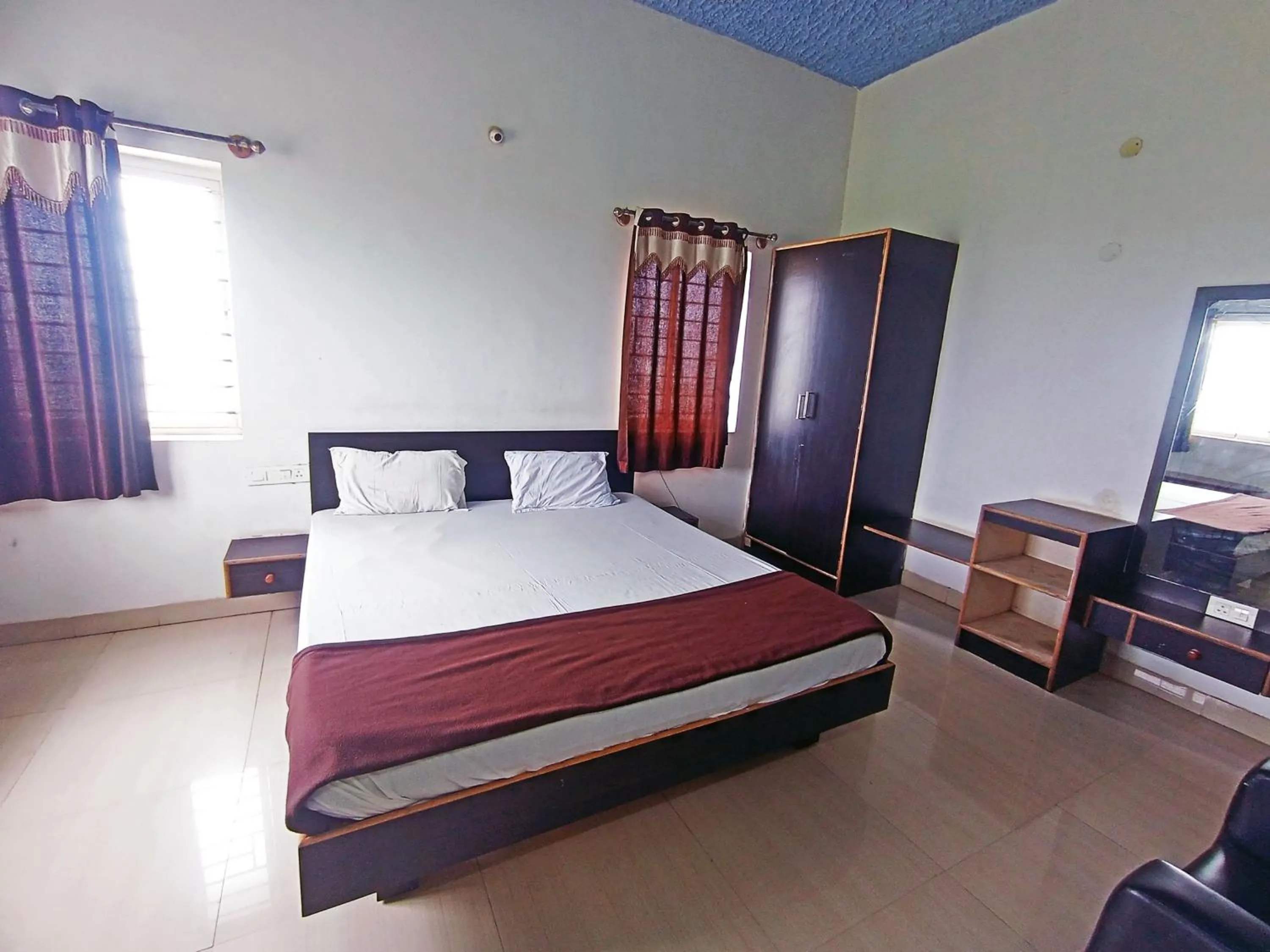 Bedroom in Savanur Deluxe Lodge