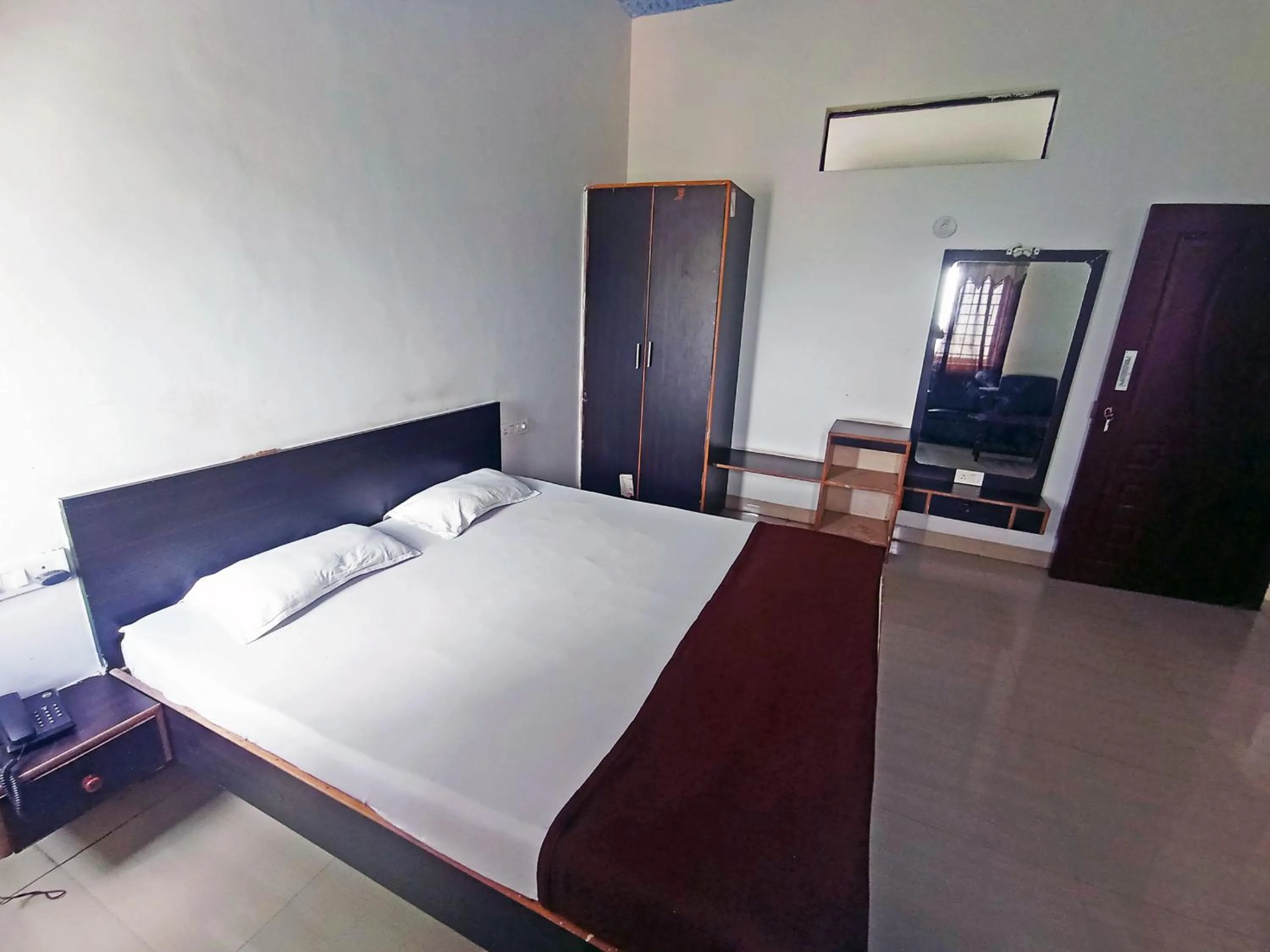 Bedroom in Savanur Deluxe Lodge
