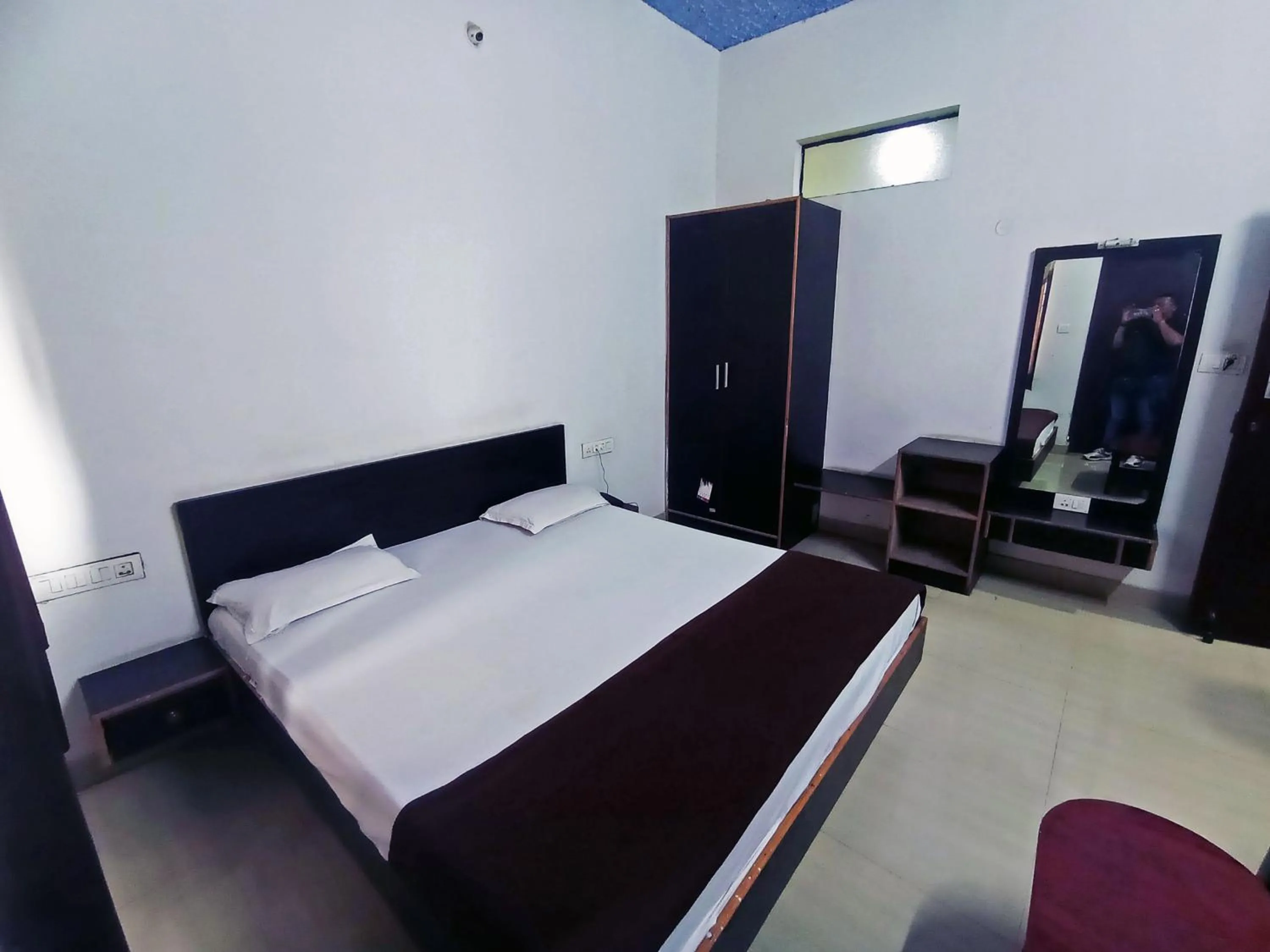 Bedroom in Savanur Deluxe Lodge