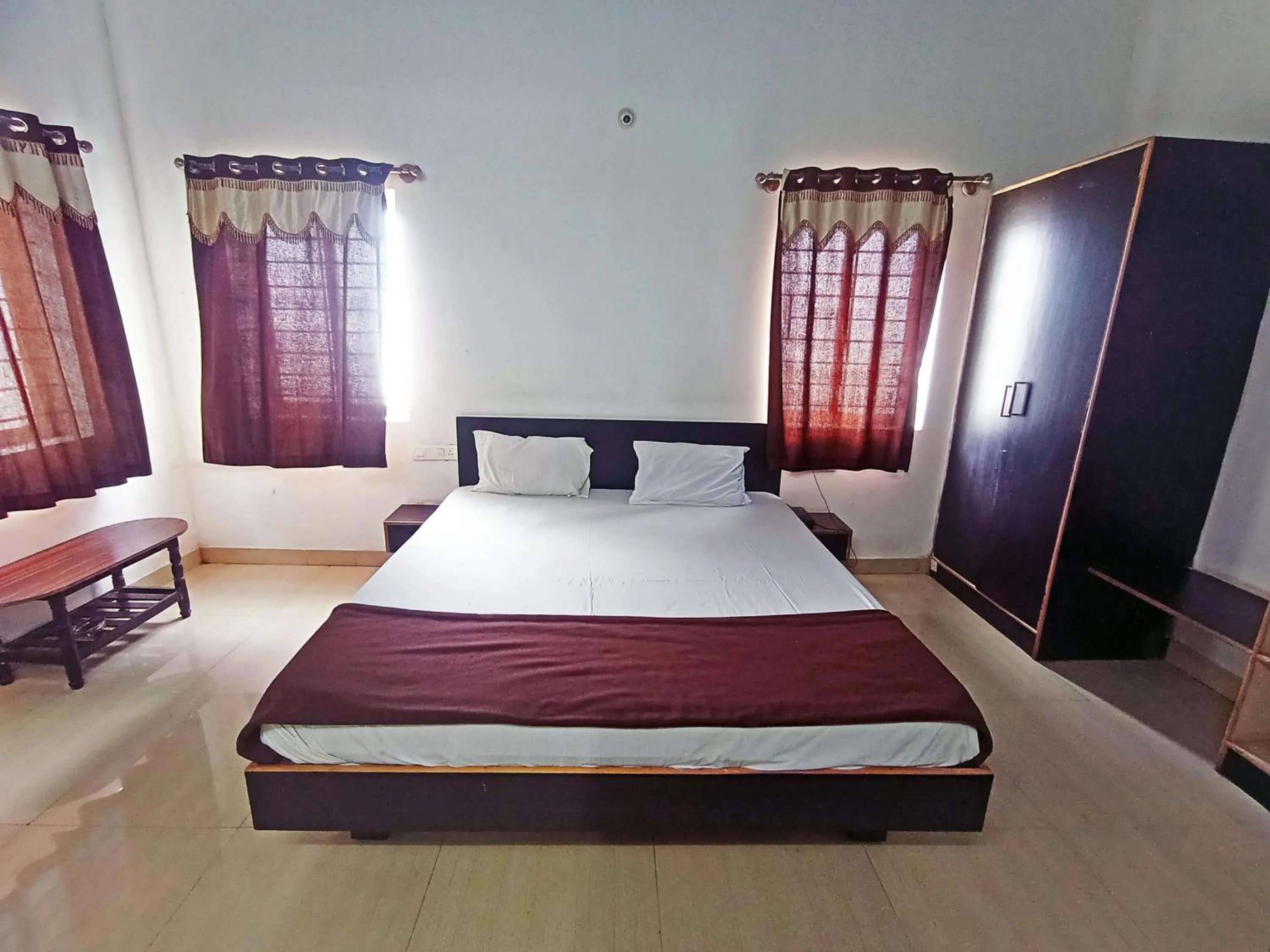 Bedroom in Savanur Deluxe Lodge