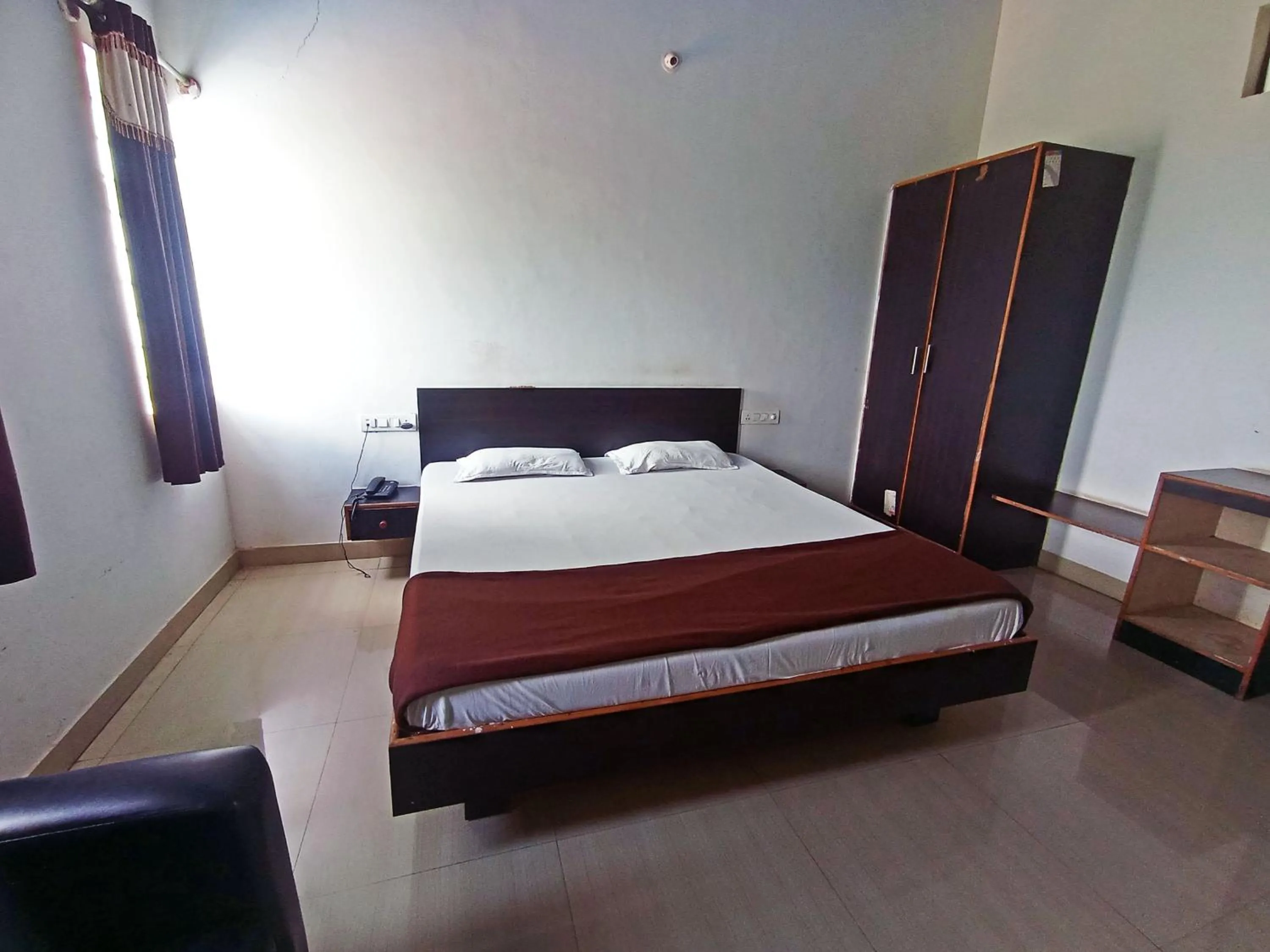 Bedroom in Savanur Deluxe Lodge