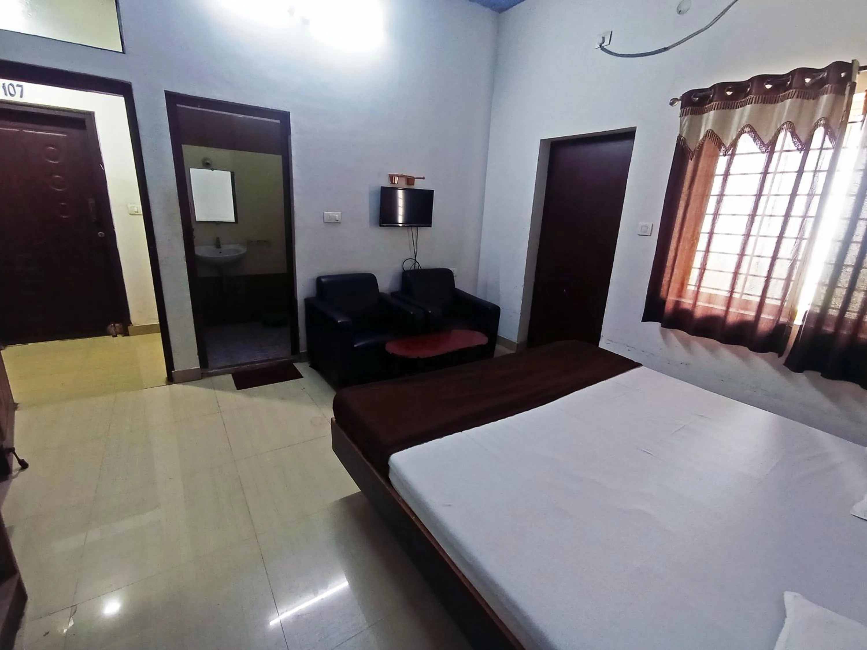 Bedroom in Savanur Deluxe Lodge