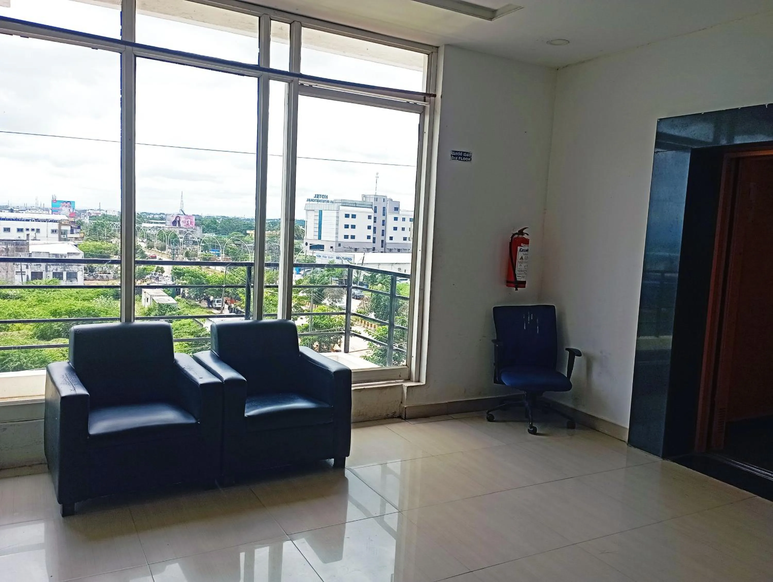 Seating area in Savanur Deluxe Lodge