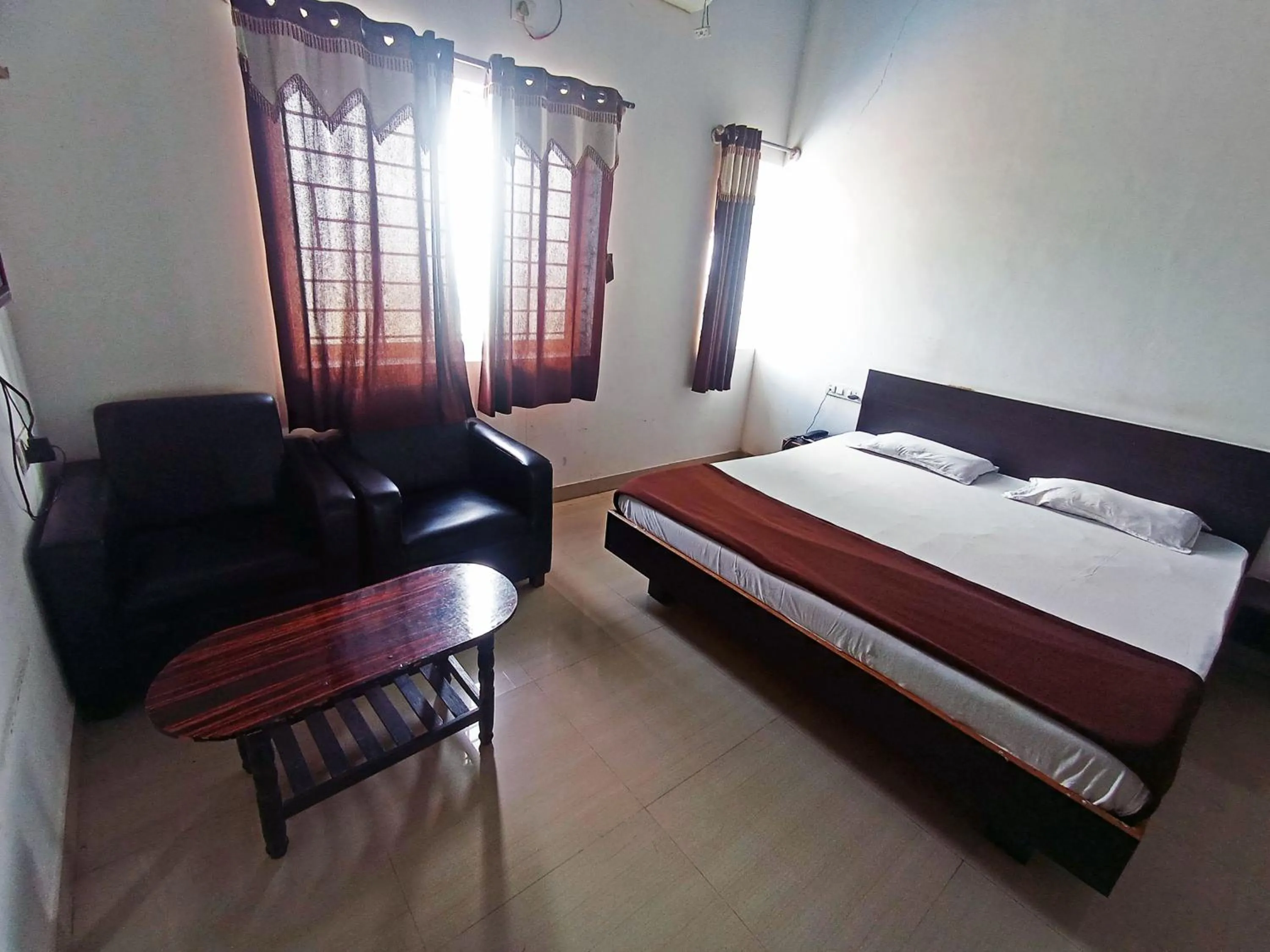 Bedroom in Savanur Deluxe Lodge
