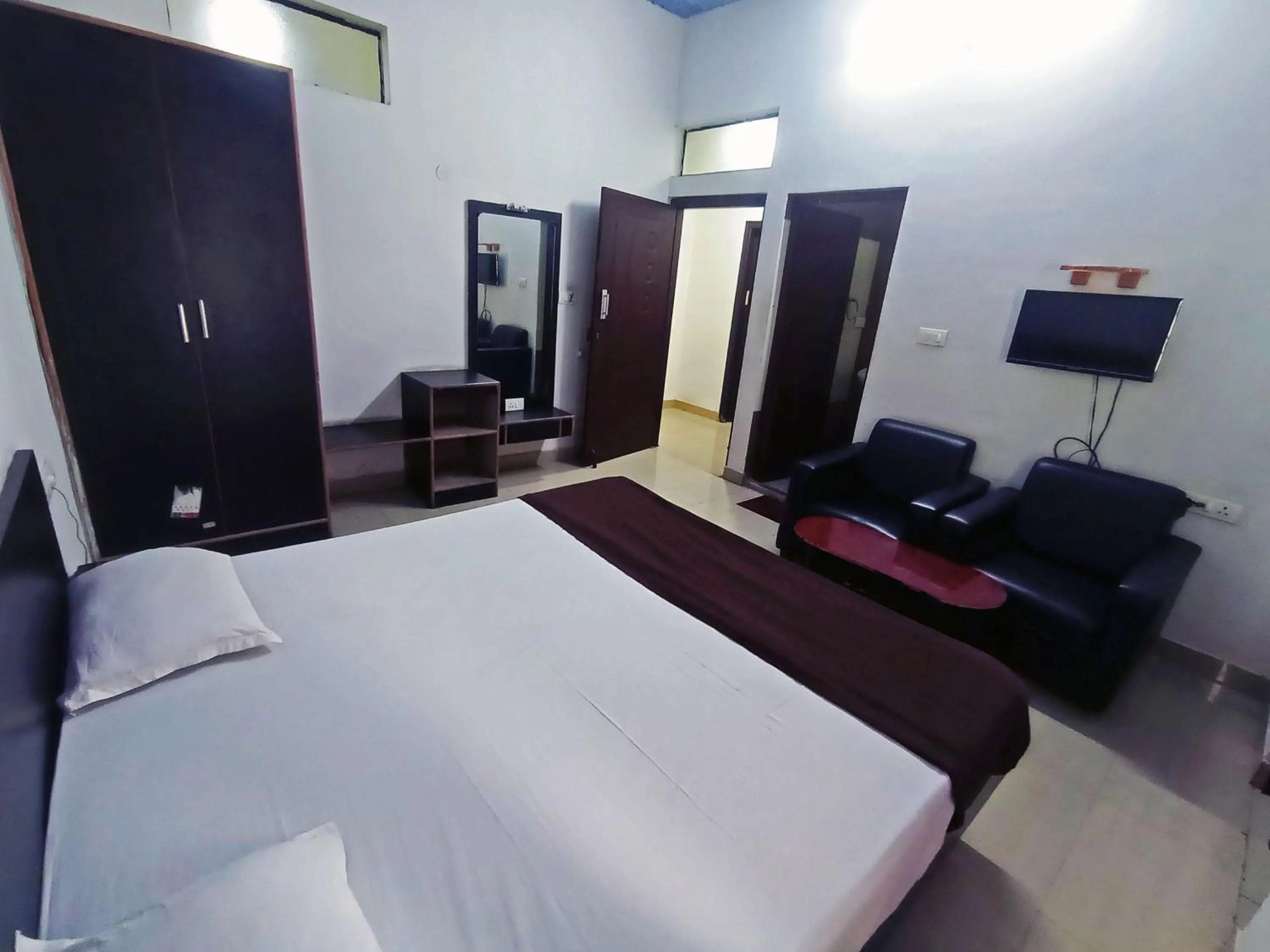 Bedroom in Savanur Deluxe Lodge