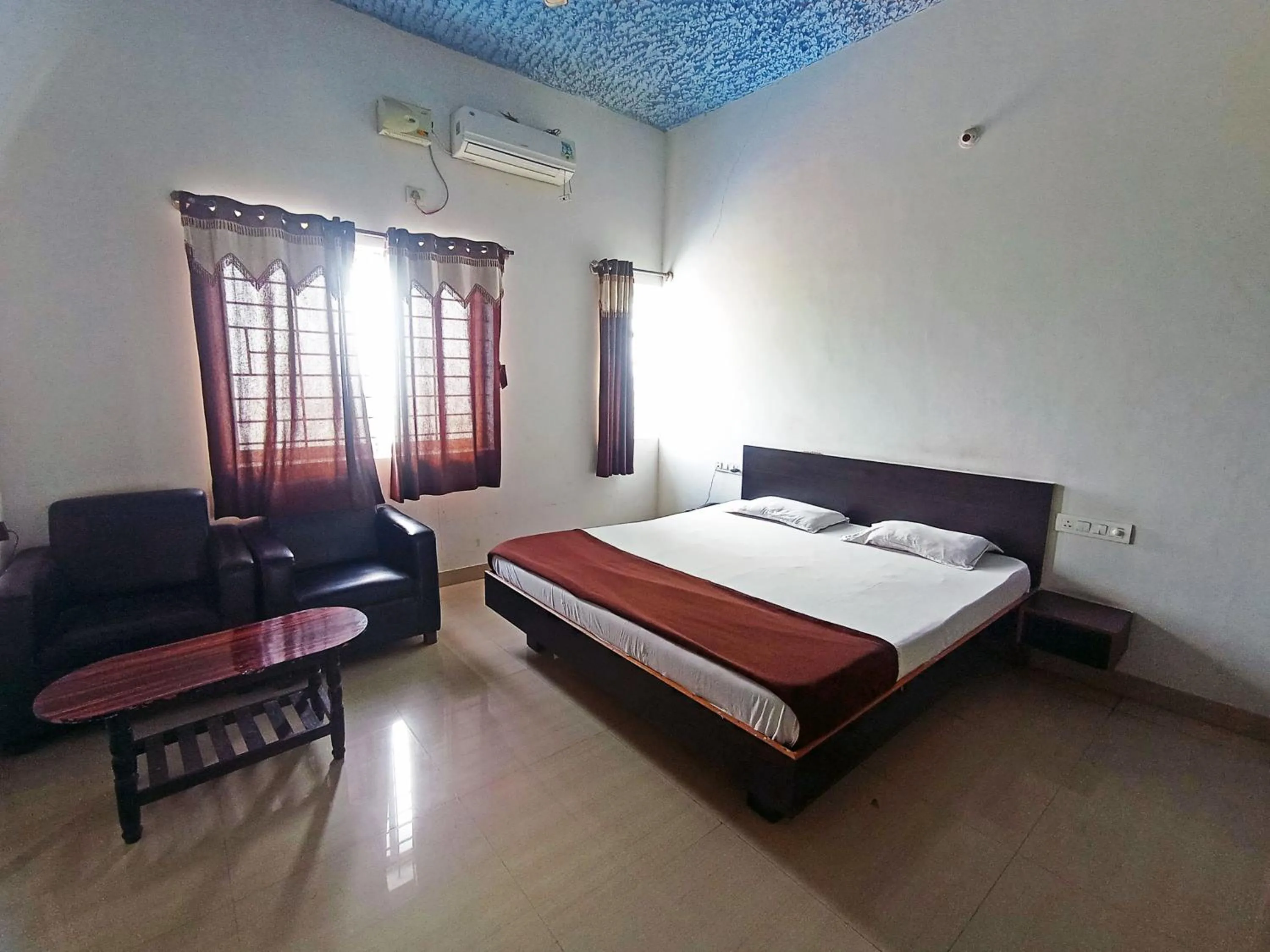 Bedroom in Savanur Deluxe Lodge