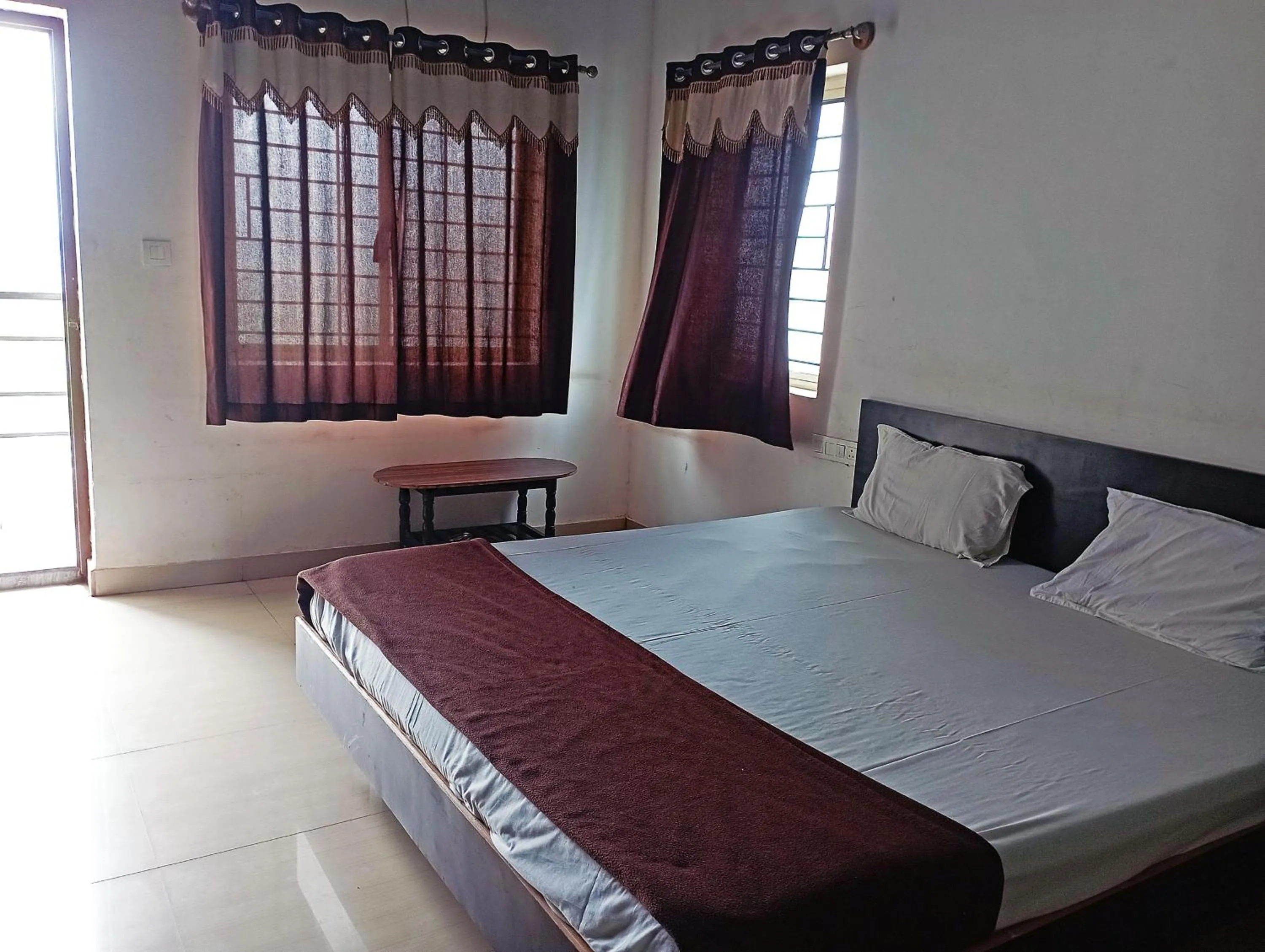Bedroom in Savanur Deluxe Lodge