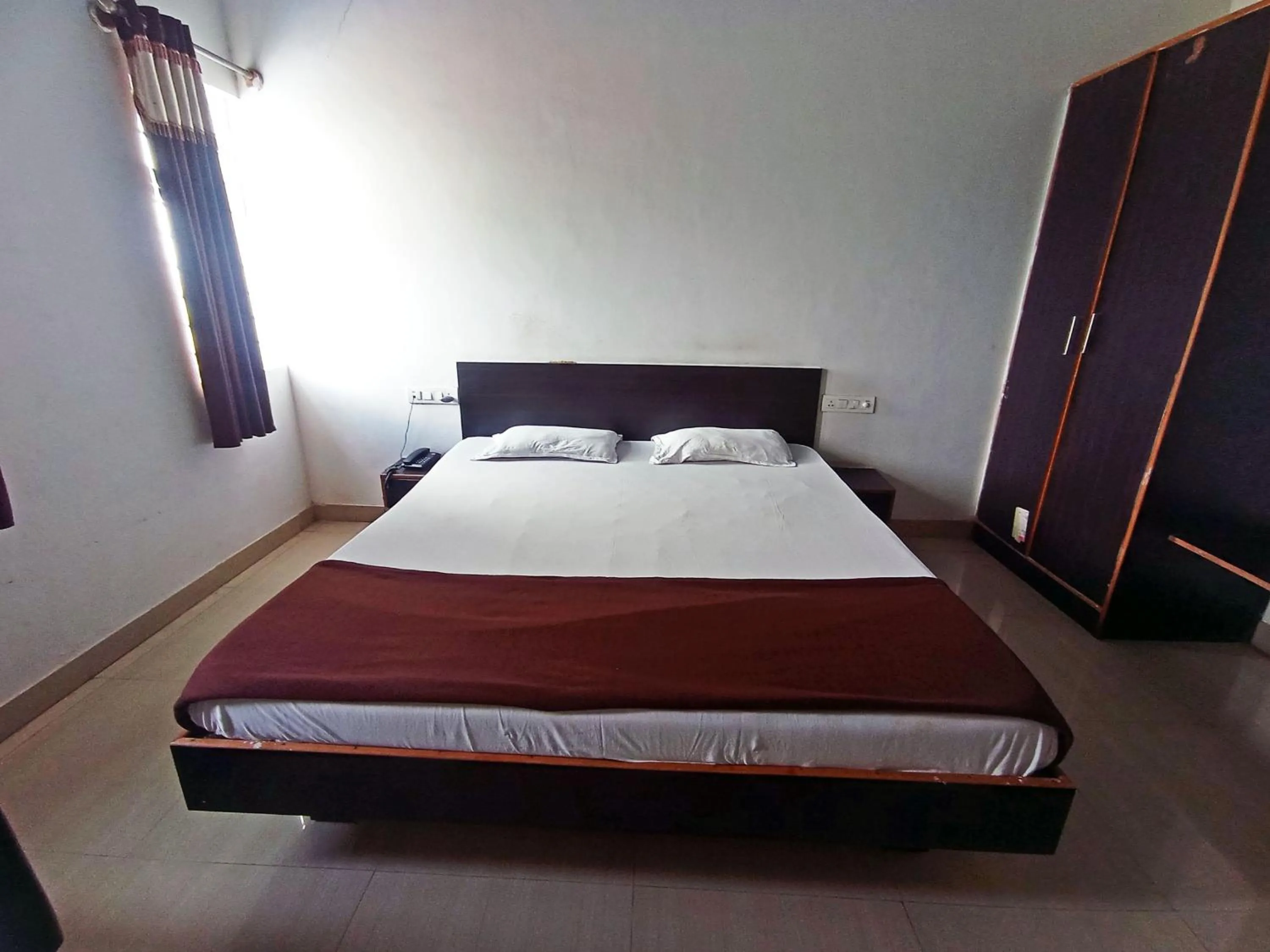Bedroom in Savanur Deluxe Lodge