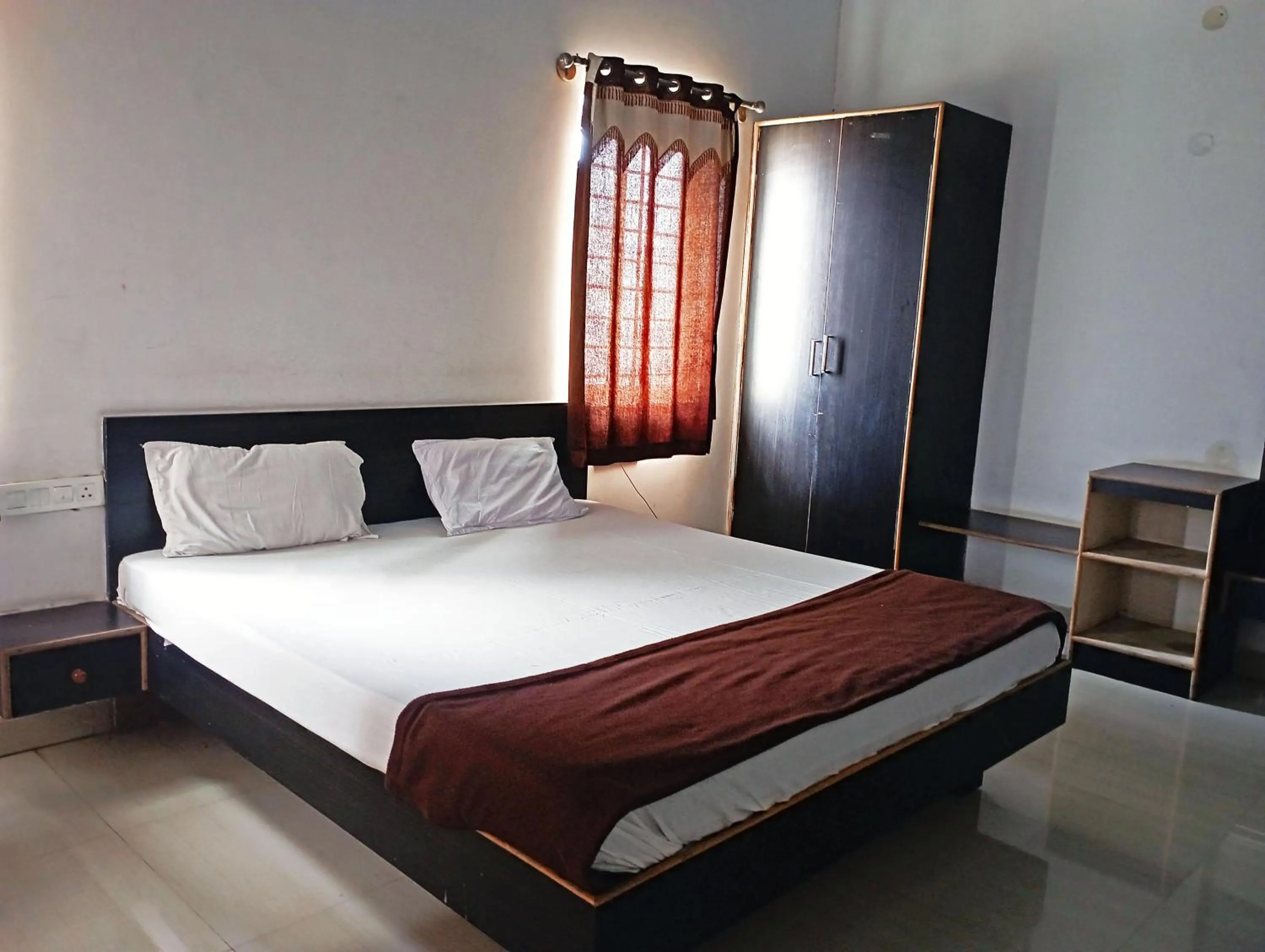 Bedroom in Savanur Deluxe Lodge