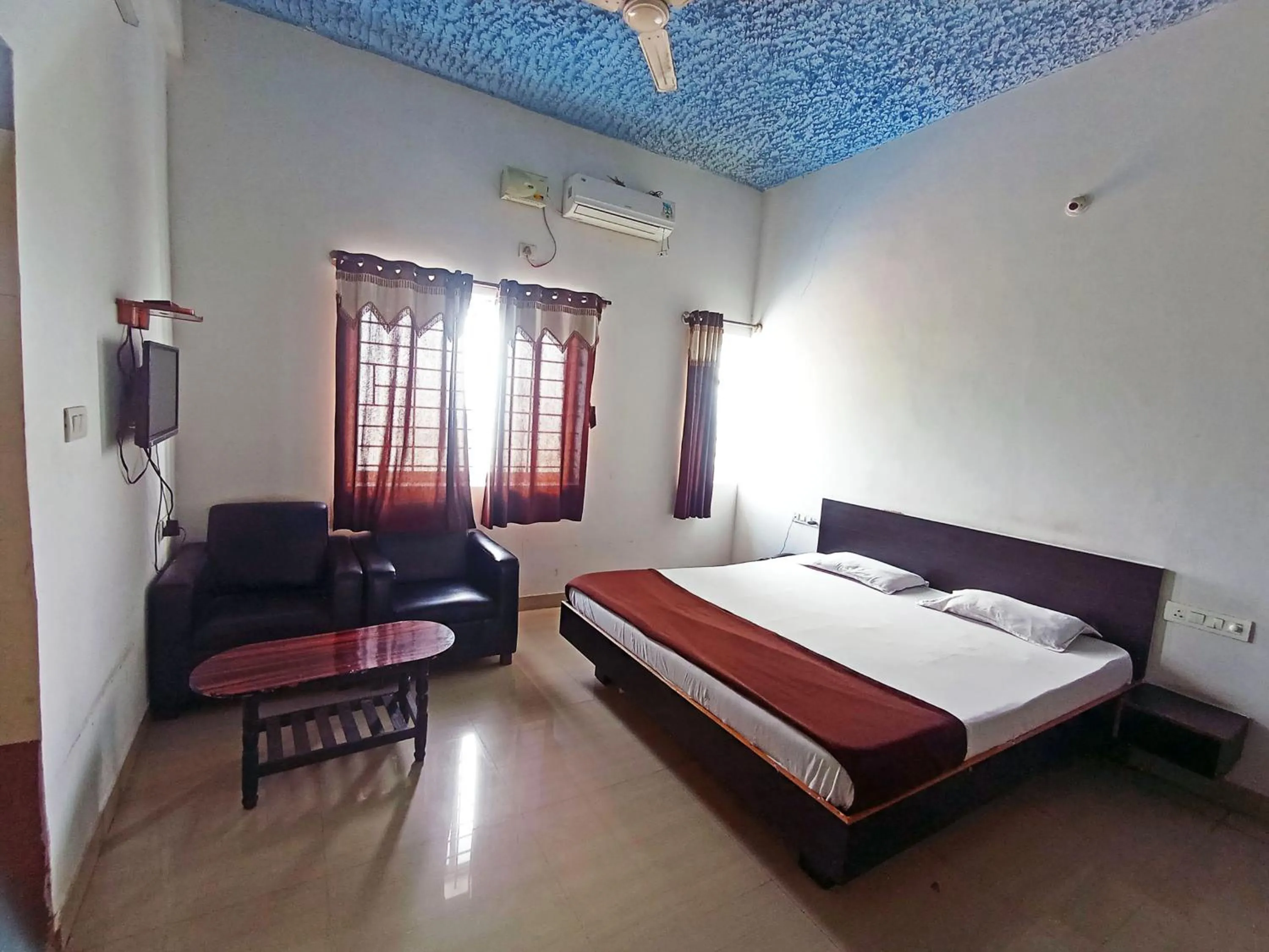 Bedroom in Savanur Deluxe Lodge