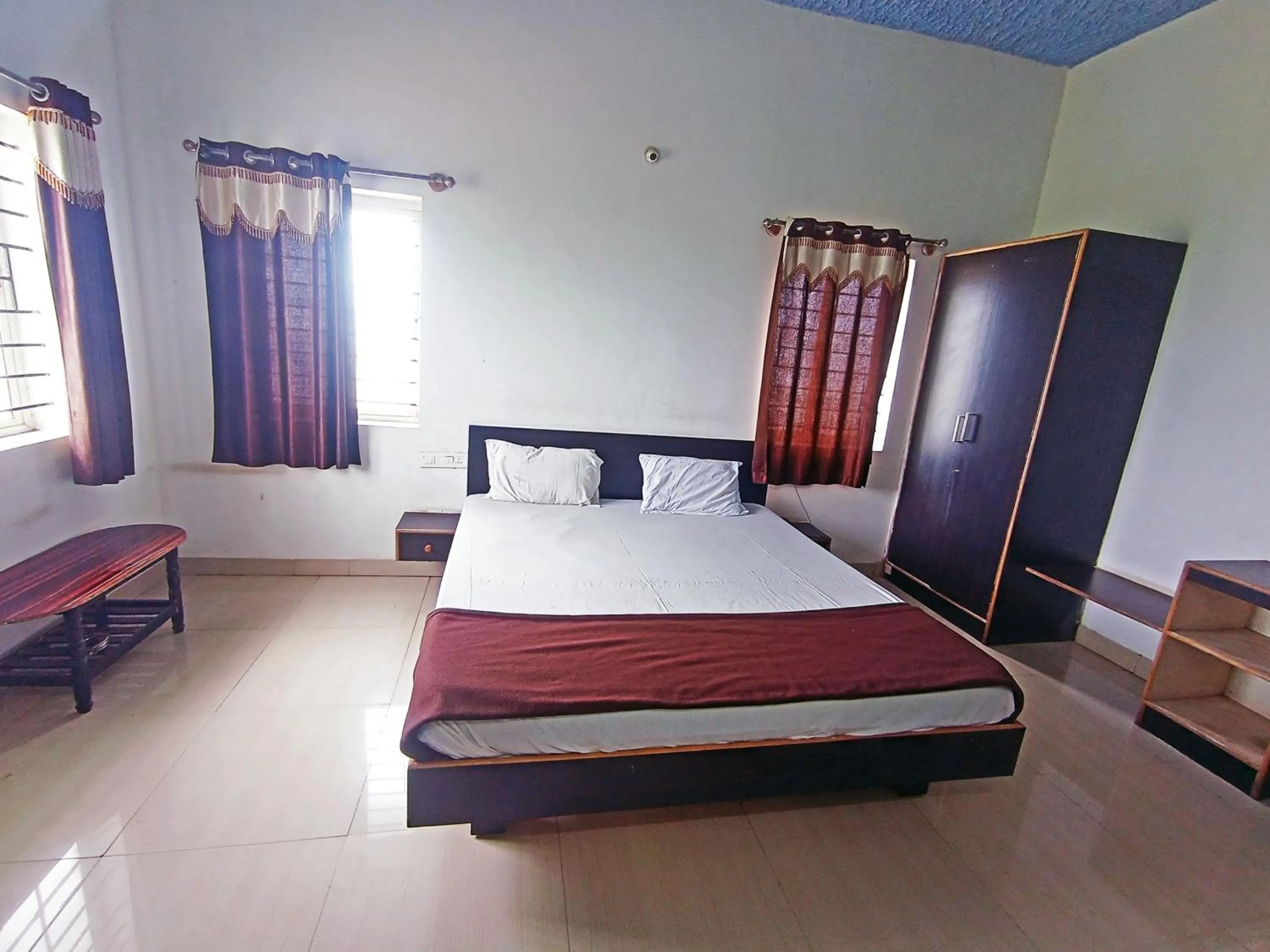 Bedroom in Savanur Deluxe Lodge