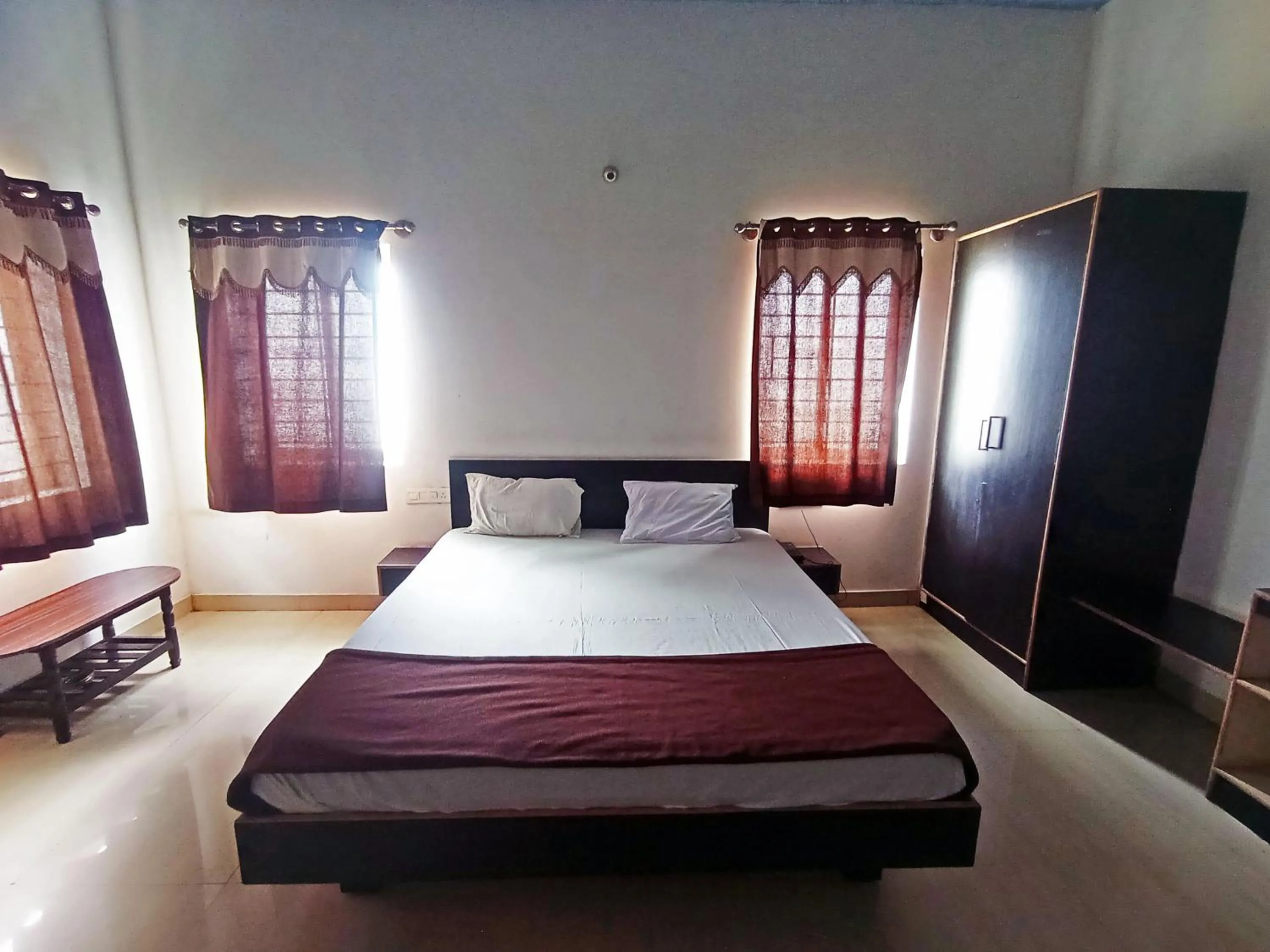 Bedroom in Savanur Deluxe Lodge
