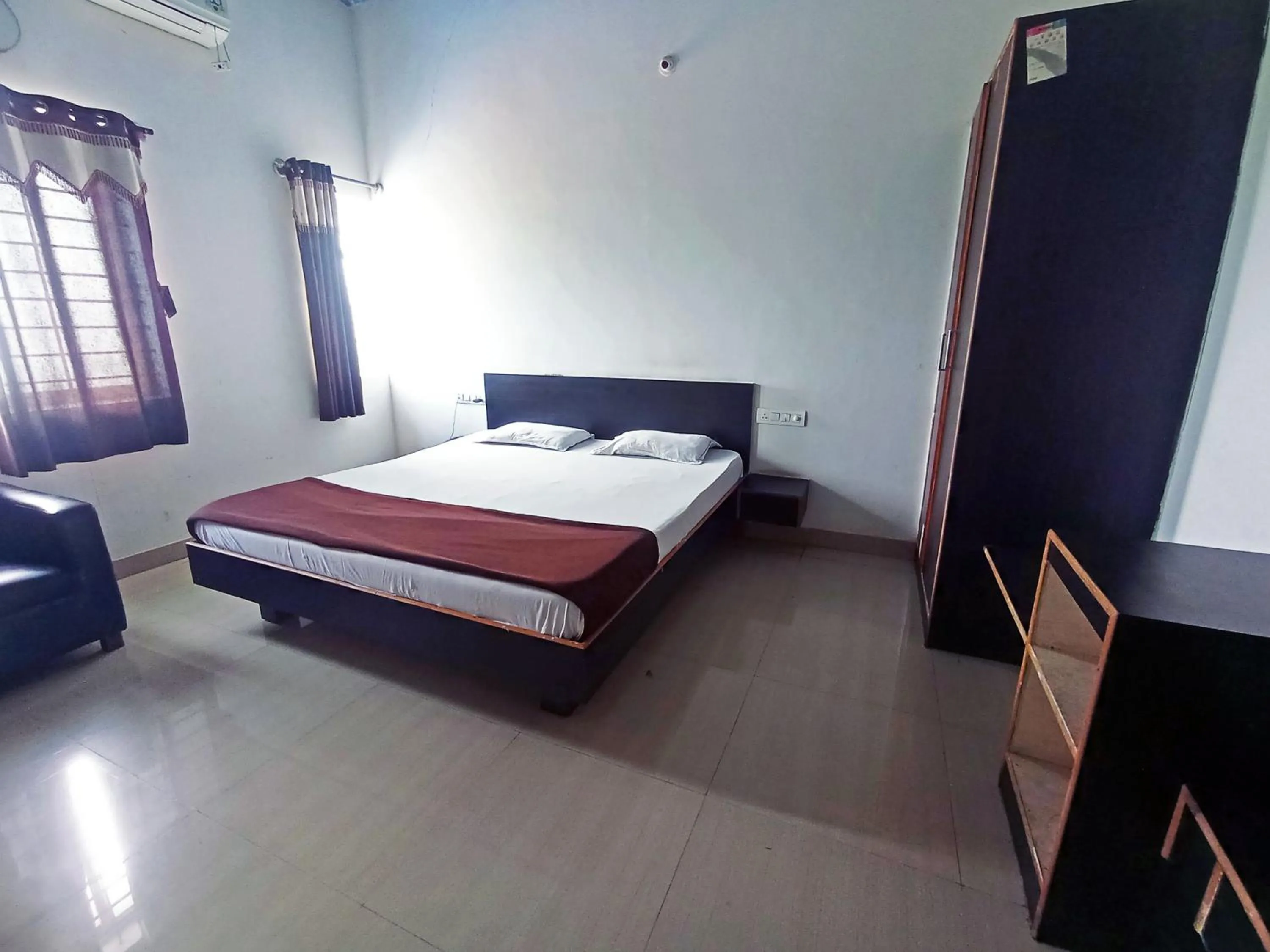 Bedroom in Savanur Deluxe Lodge