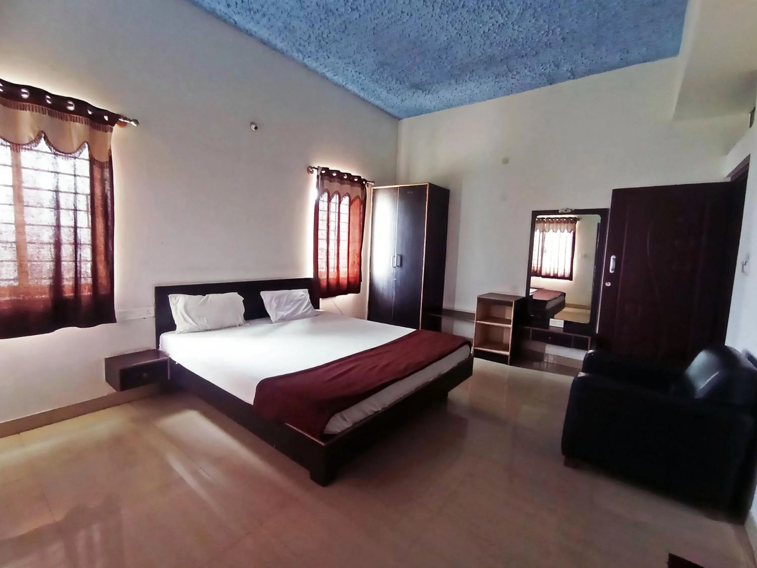 Bedroom in Savanur Deluxe Lodge