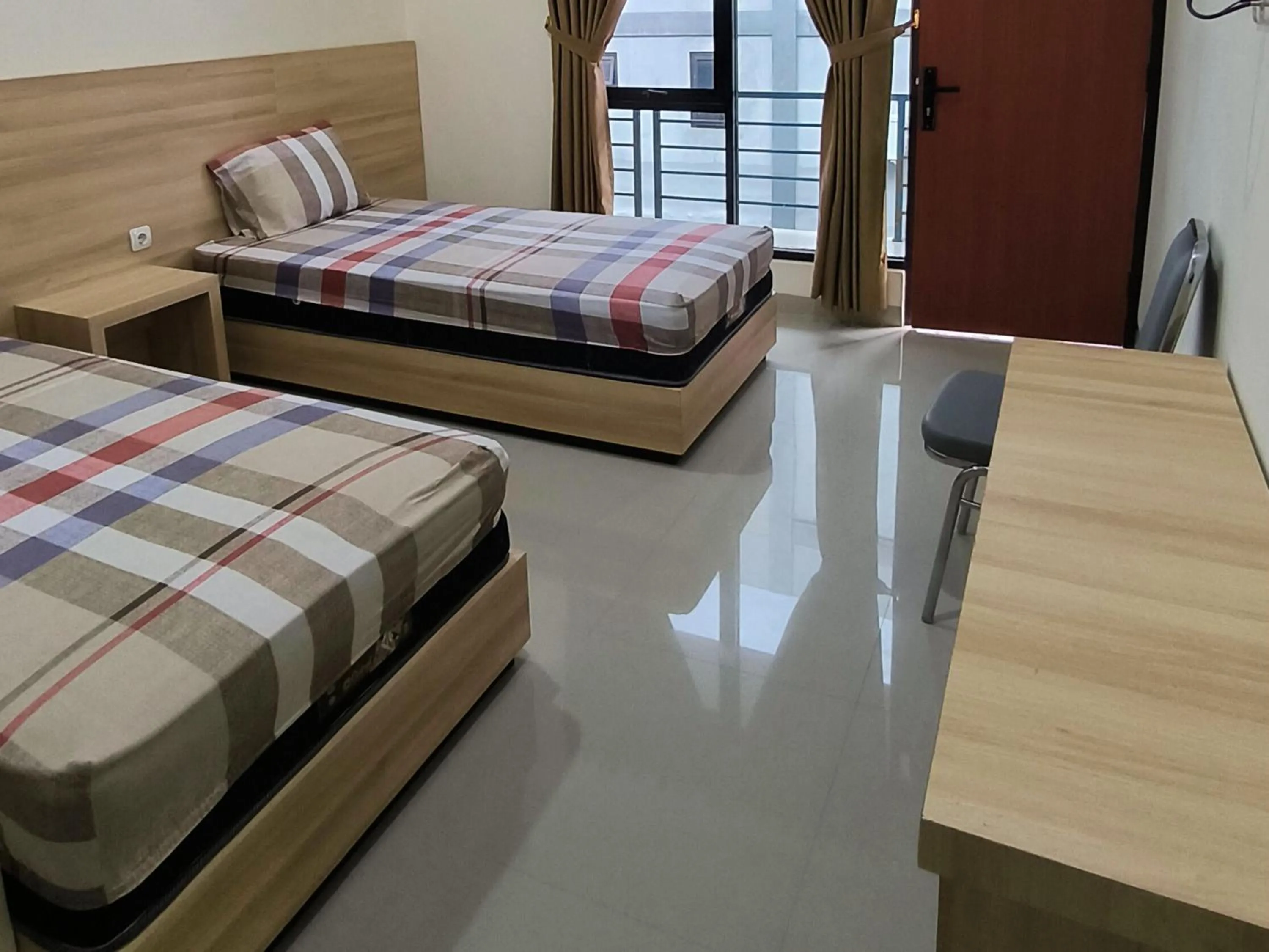 Bed in Tentrem Guesthouse Baru